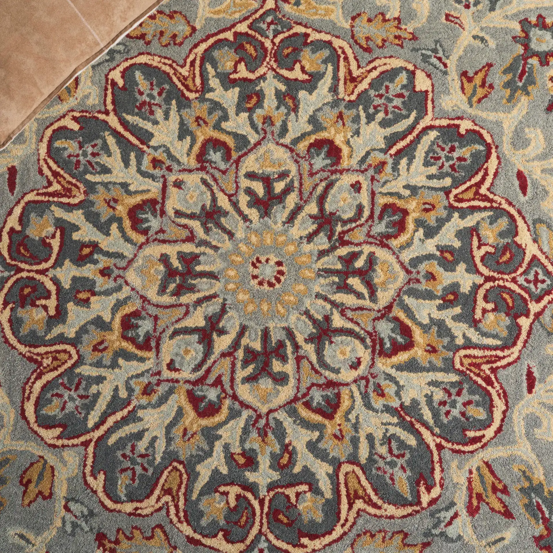 Heritage Palmette Medallion Hand-Tufted Wool Rug in Gray / Charcoal in a styled room