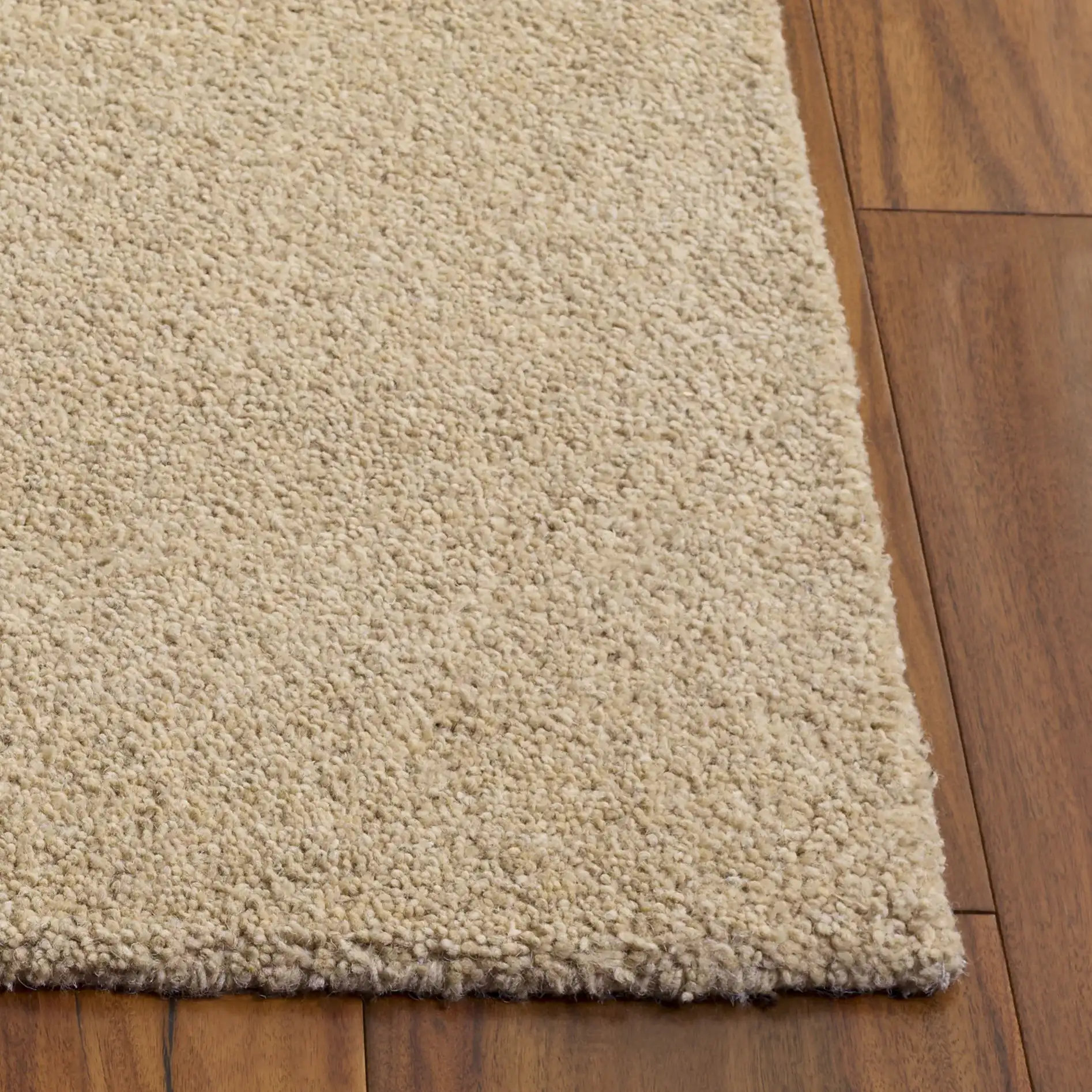 Himalaya Solid Hand-Tufted Wool Rug in Beige in a styled room