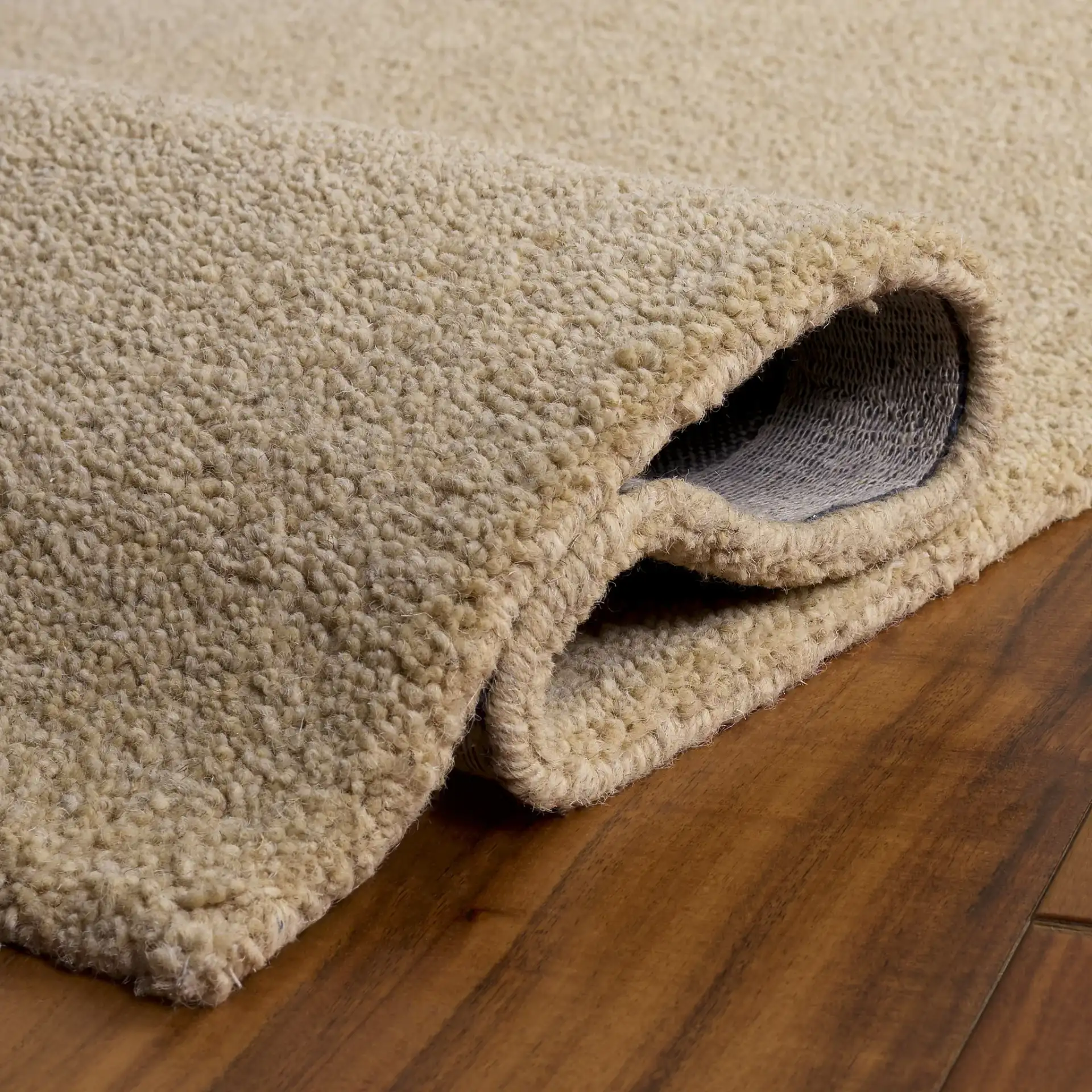 Himalaya Solid Hand-Tufted Wool Rug in Beige in a styled room