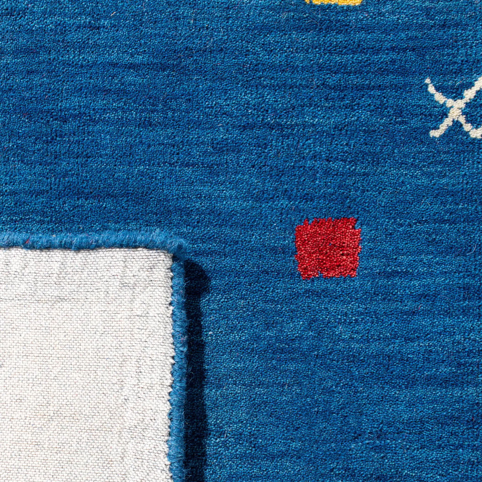 Himalaya Tribal Border Hand-Loomed Wool Rug in Blue in a styled room