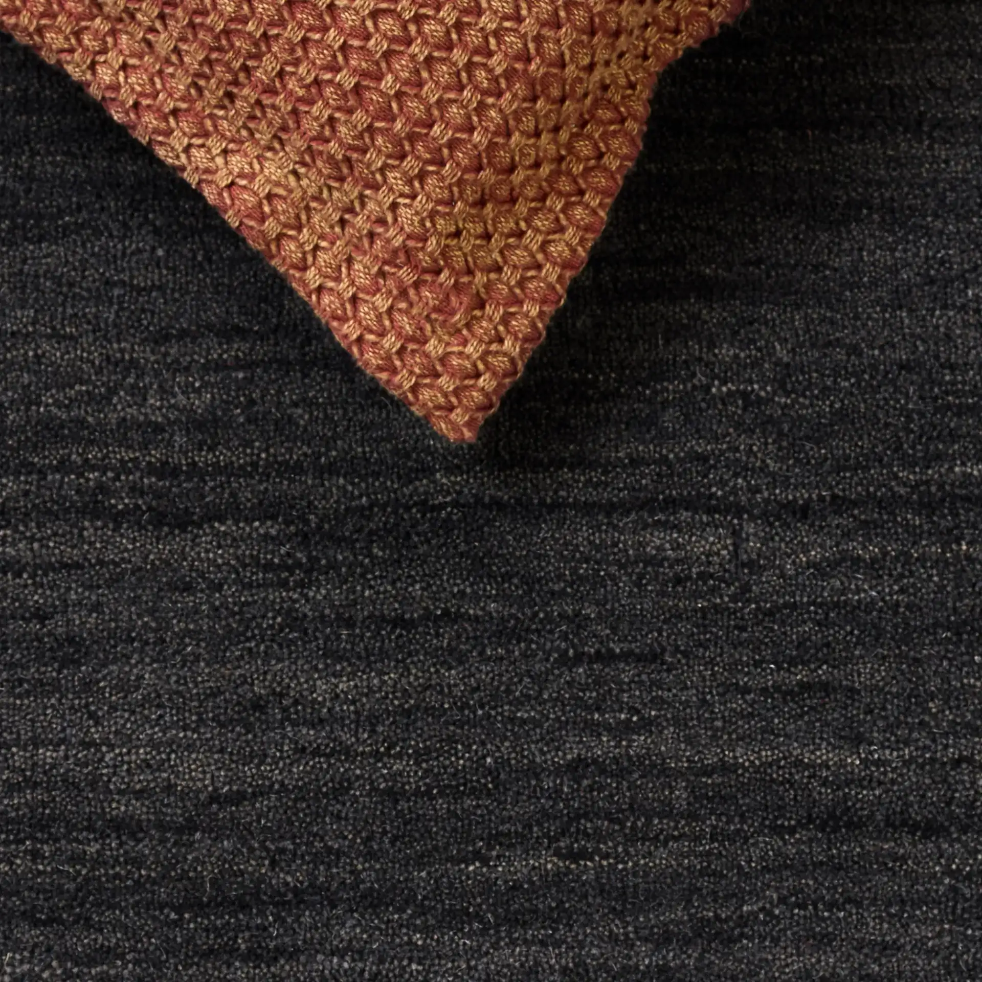 Himalaya Bordered Hand-Loomed Wool Rug in Charcoal in a styled room
