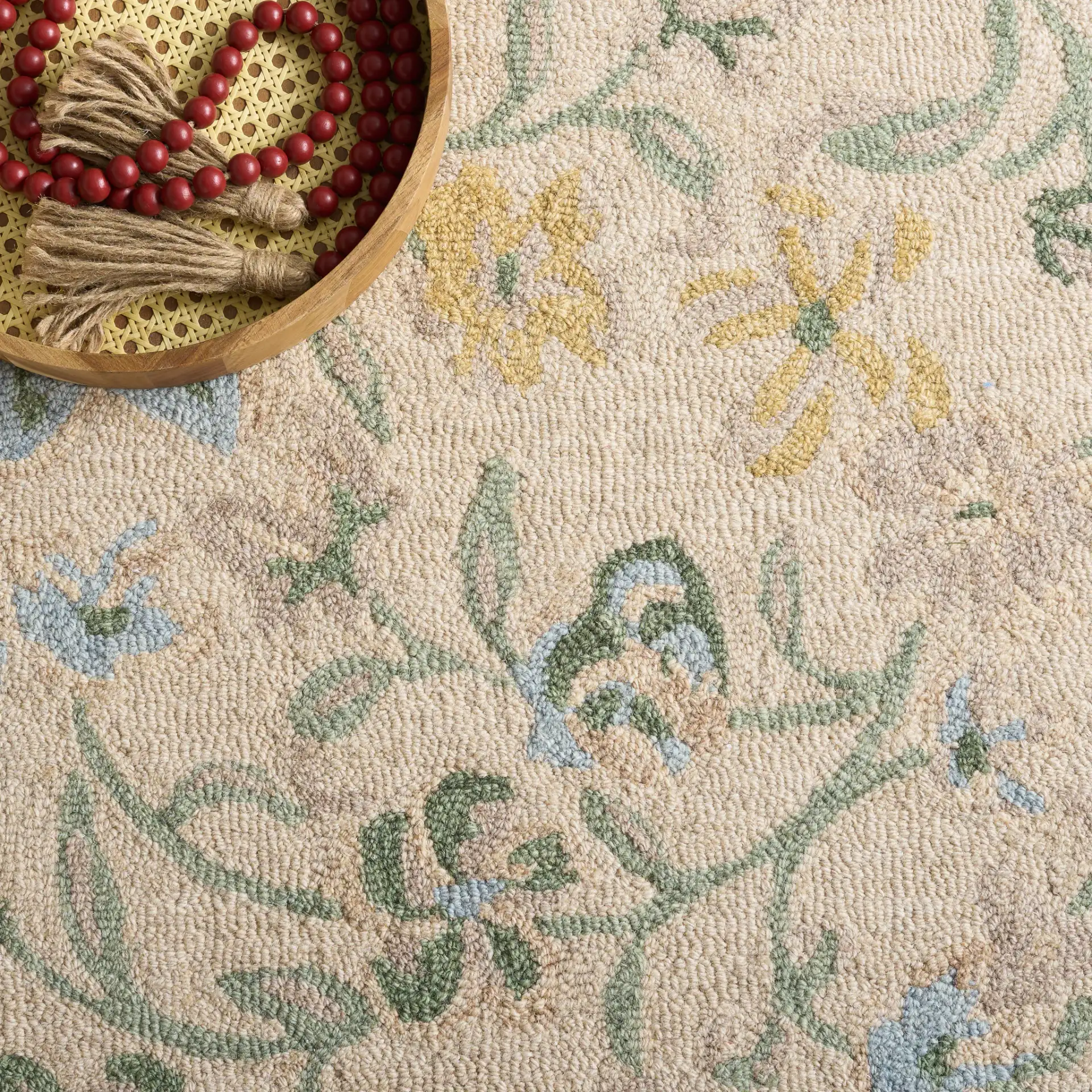 Chelsea Floral Vine Hand-Tufted Wool Rug in Beige / Green in a styled room