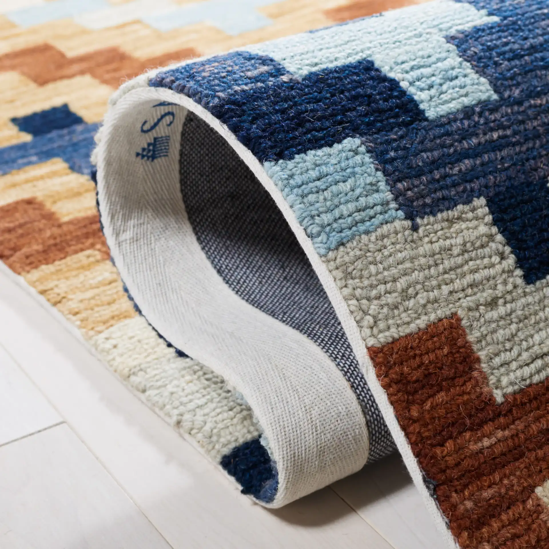 Chelsea Stepped Diamond Hand-Hooked Wool Rug in Orange / Multicolor in a styled room