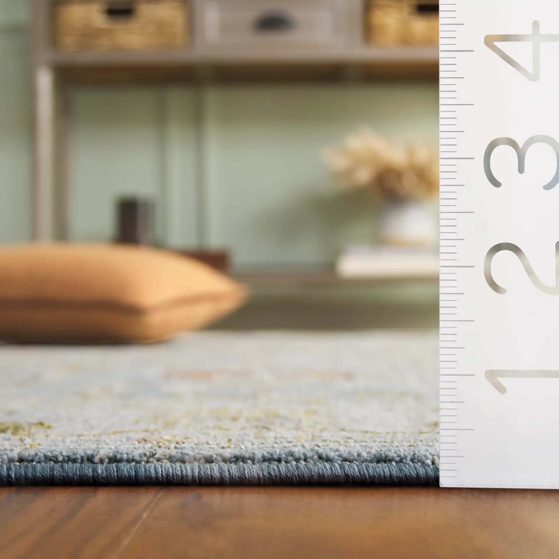 Hamilton Floral Bordered Rug in Blue / Gold in a styled room