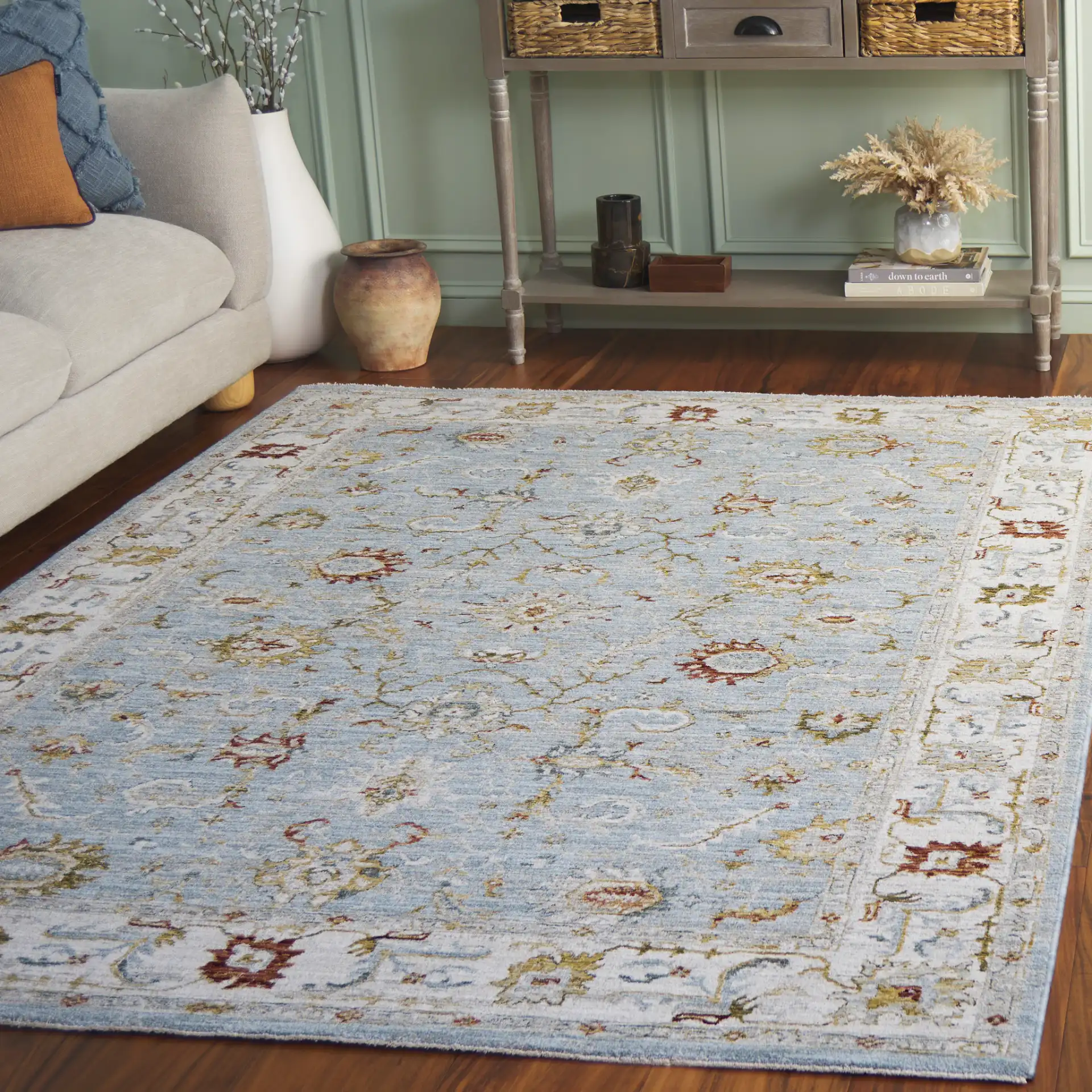 Hamilton Floral Bordered Rug in Blue / Gold in a styled room