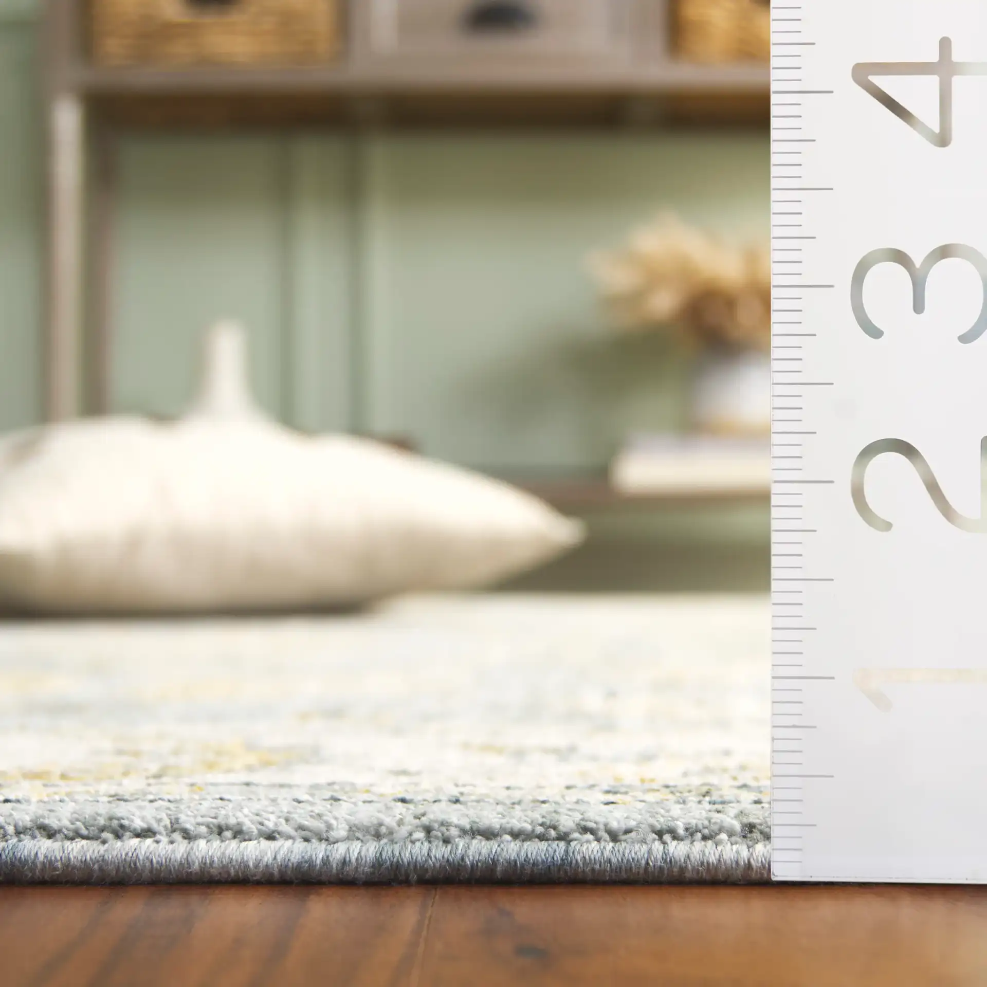 Hamilton Bordered Floral Rug in Blue / Gold in a styled room