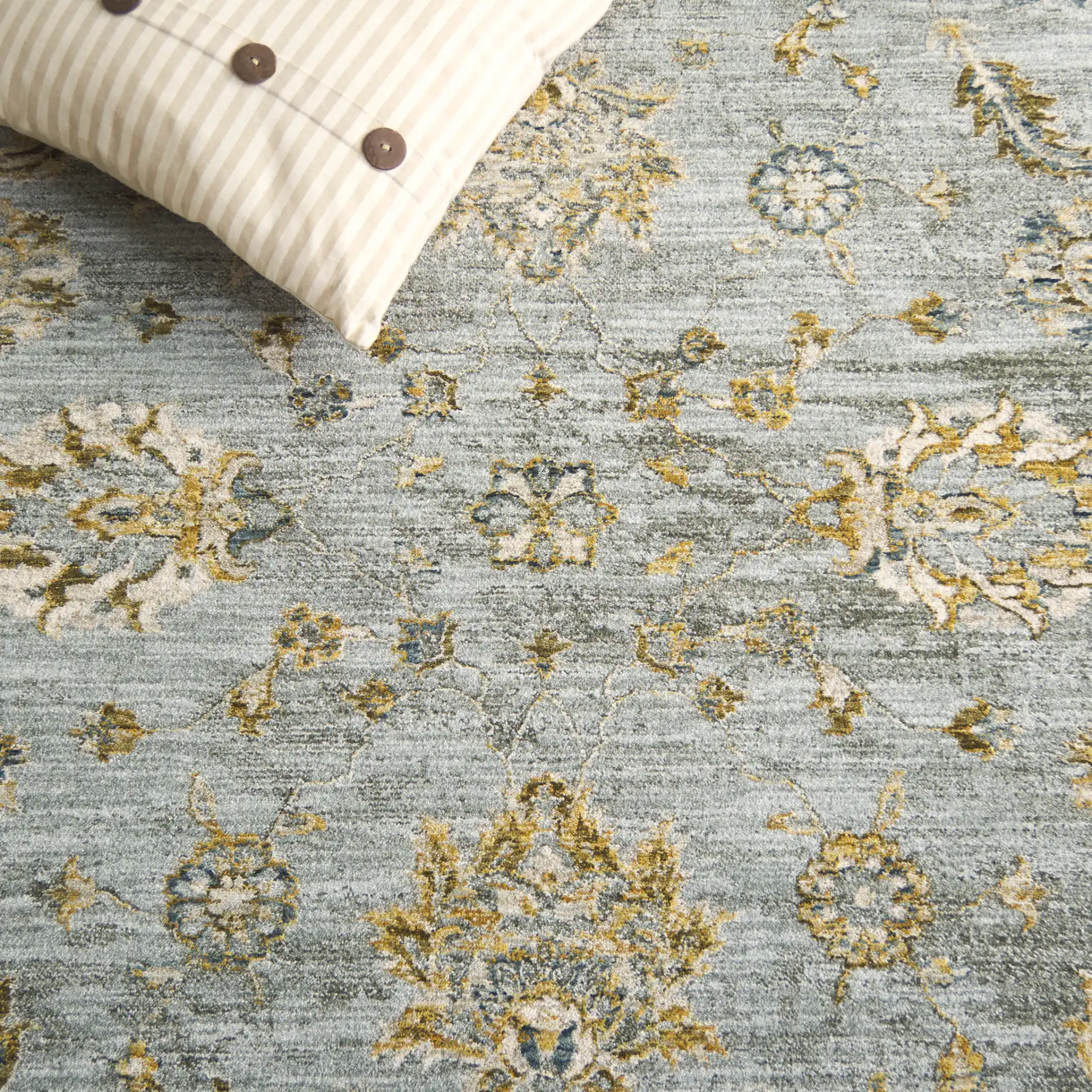 Hamilton Bordered Floral Rug in Blue / Gold in a styled room