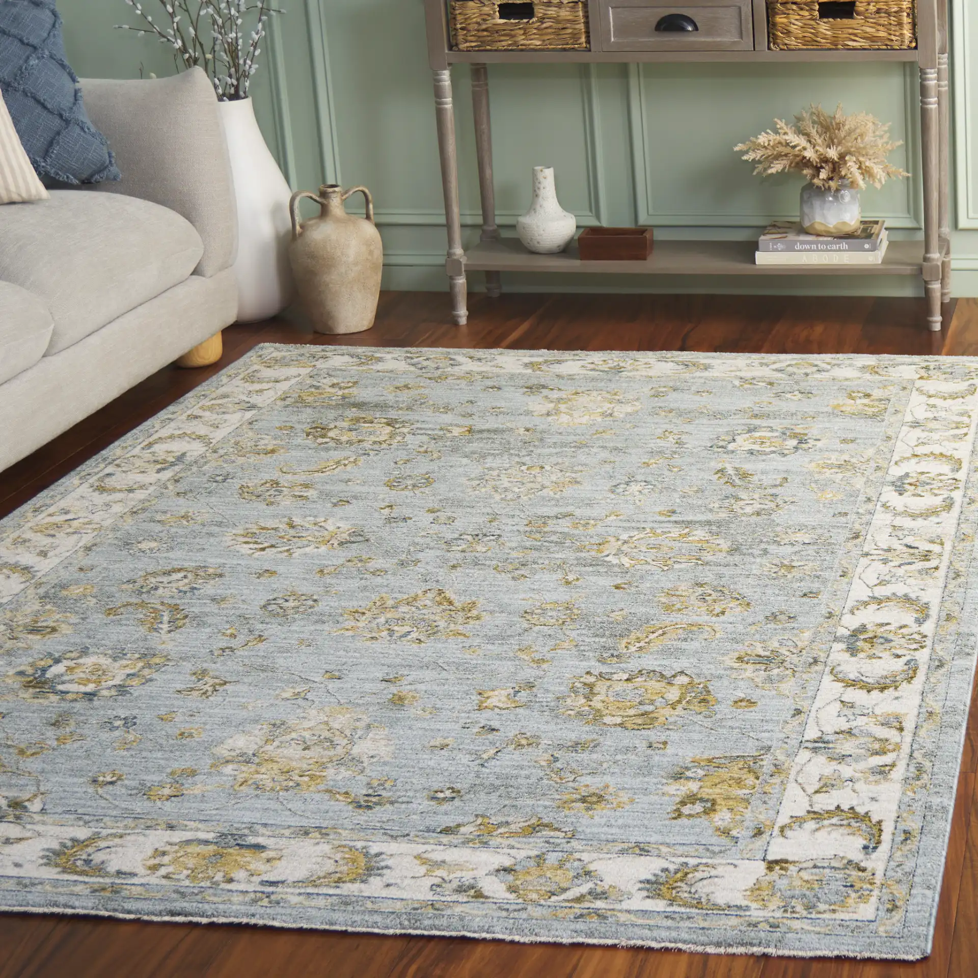 Hamilton Bordered Floral Rug in Blue / Gold in a styled room