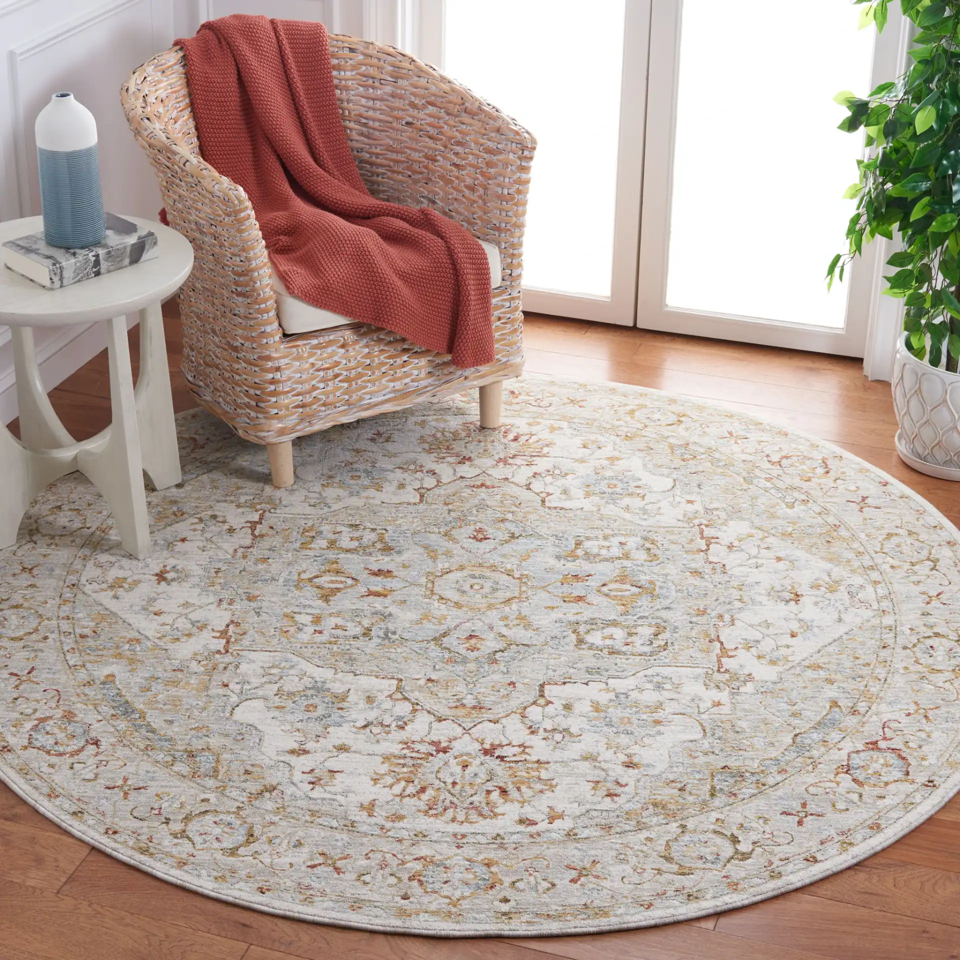 Hamilton Medallion Bordered Rug in Ivory / Blue in a styled room