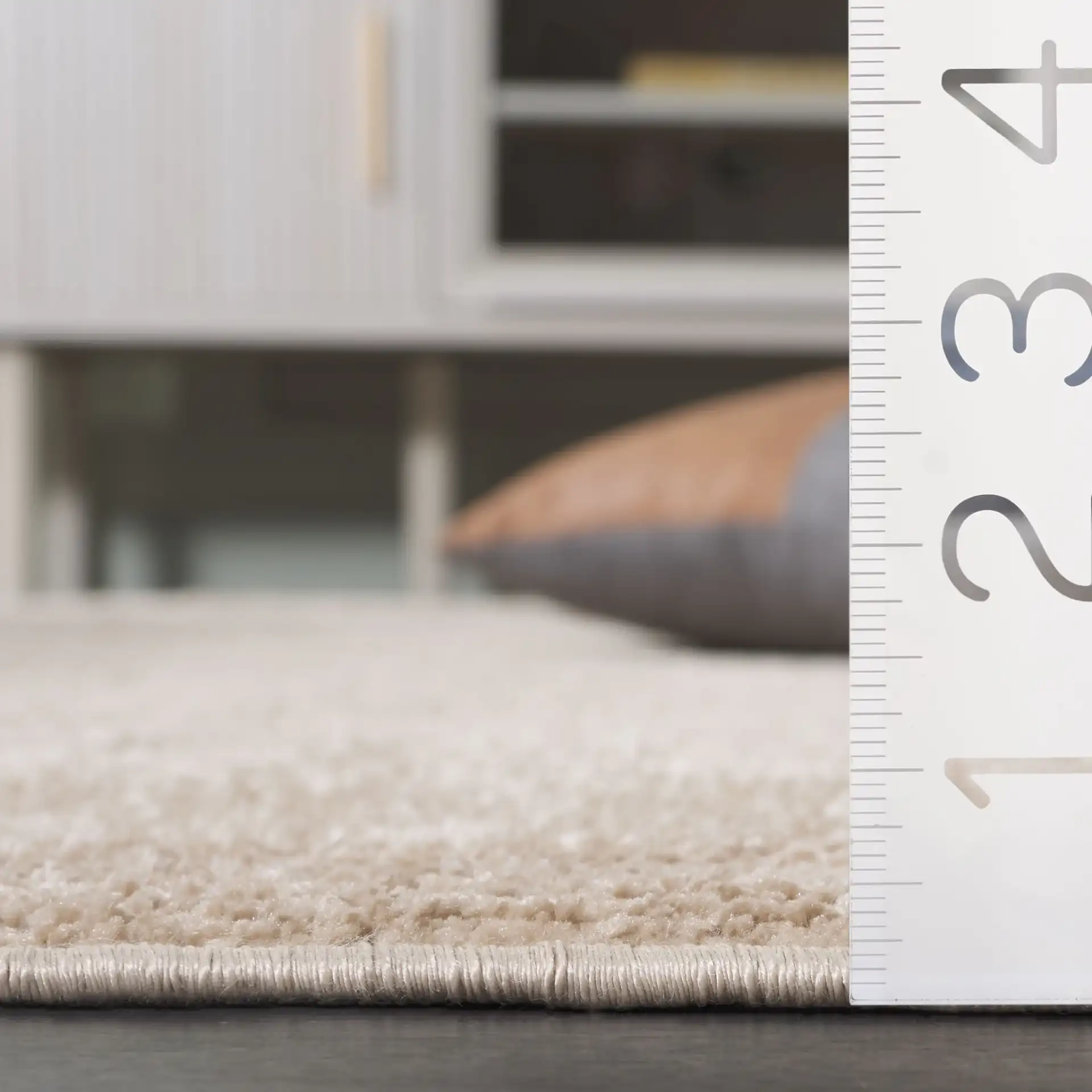 Harmony Ribbed Solid Rug in Beige in a styled room