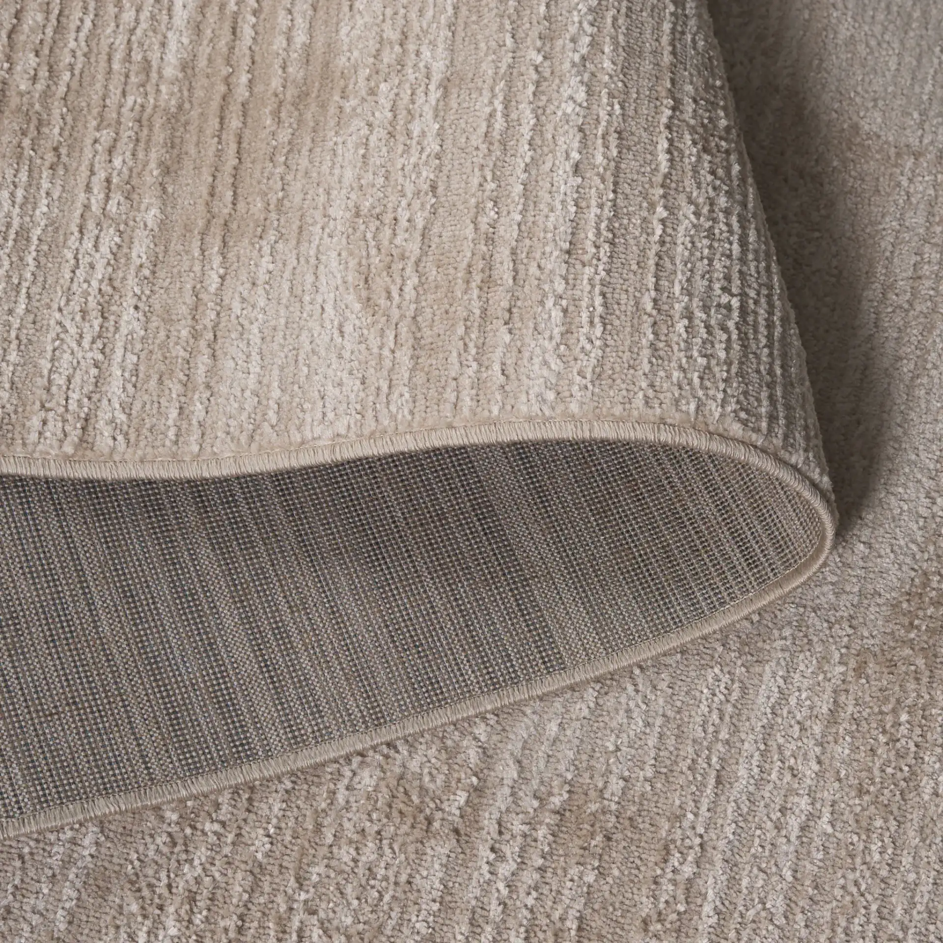 Harmony Ribbed Solid Rug in Beige in a styled room