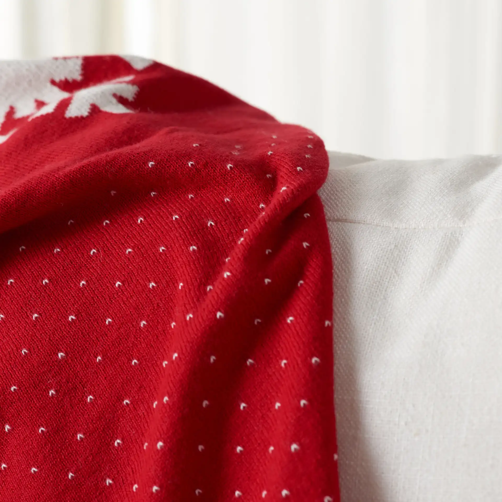 Frosty Throw in Red / White in a styled room