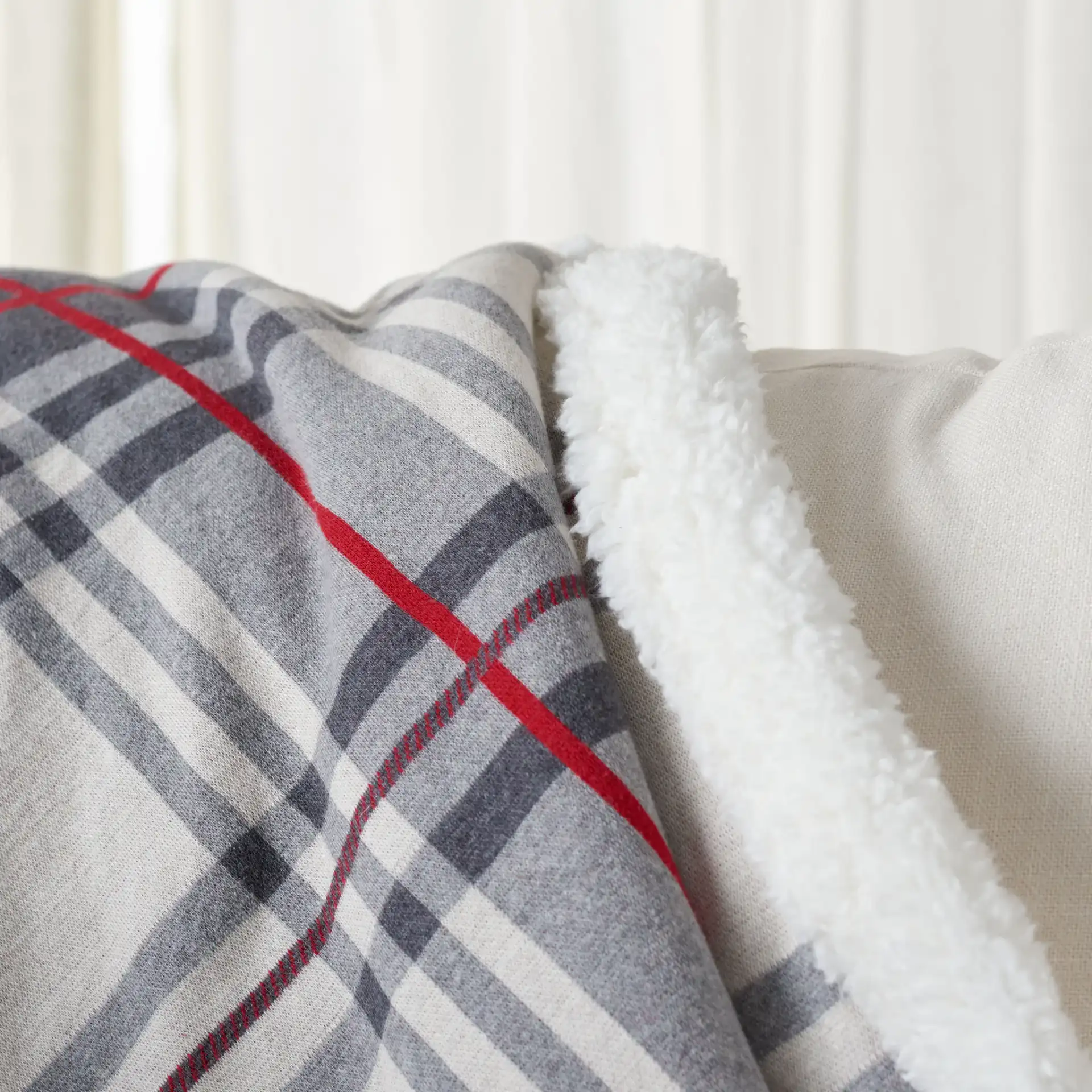 Ribbon Throw in Gray / Red in a styled room