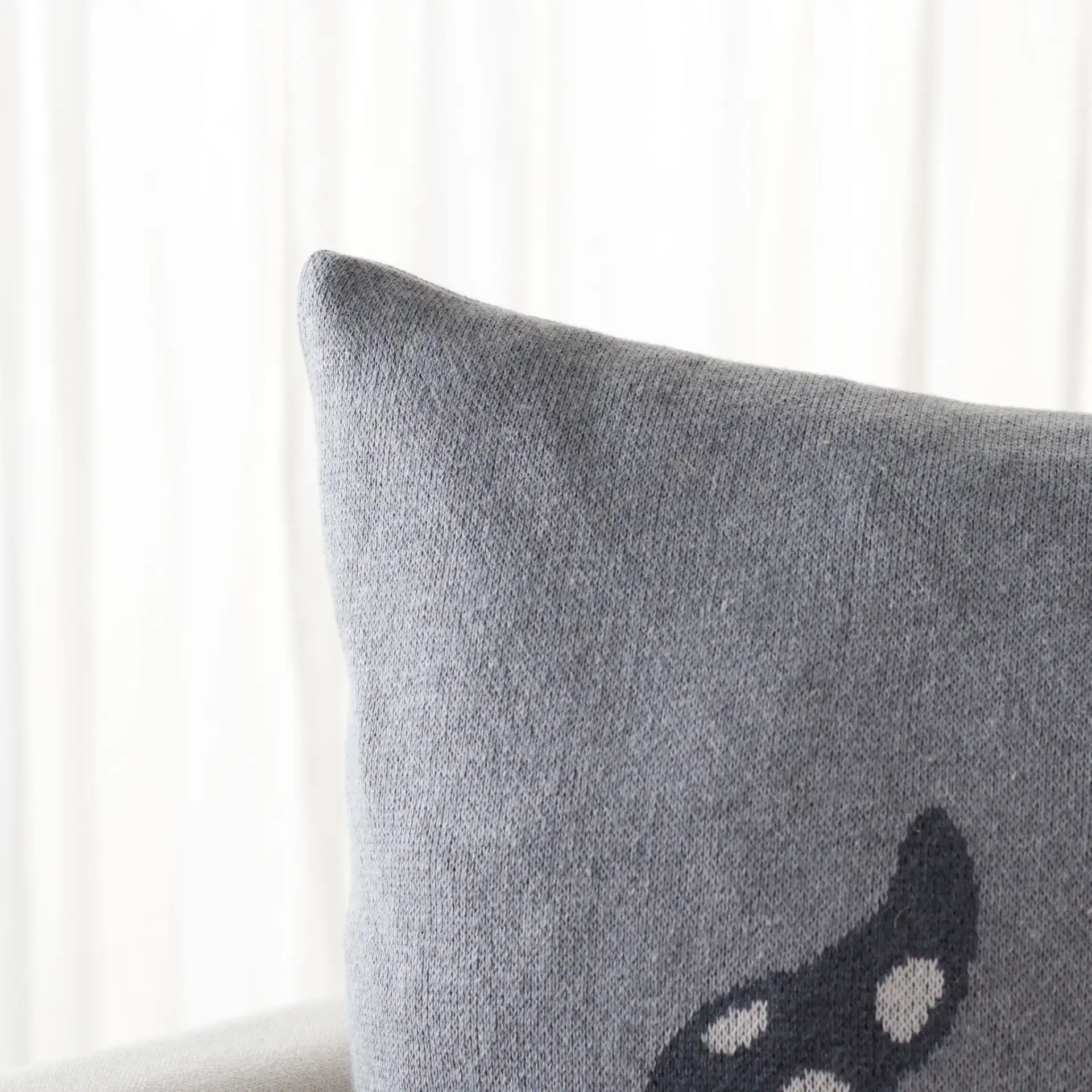 Trio Elves Pillow in Gray / Red in a styled room