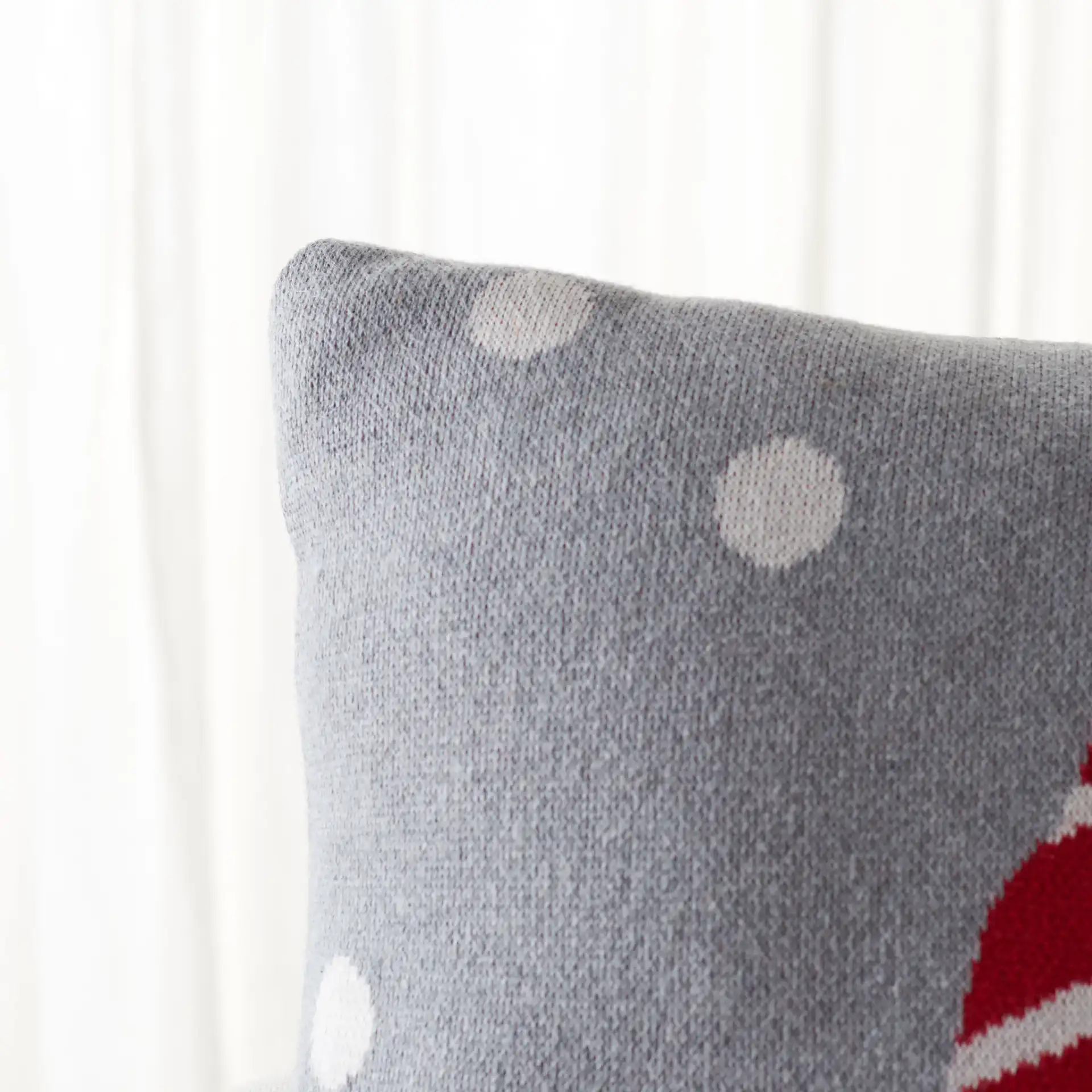 Peppermint Elf Pillow in Gray / Red in a styled room