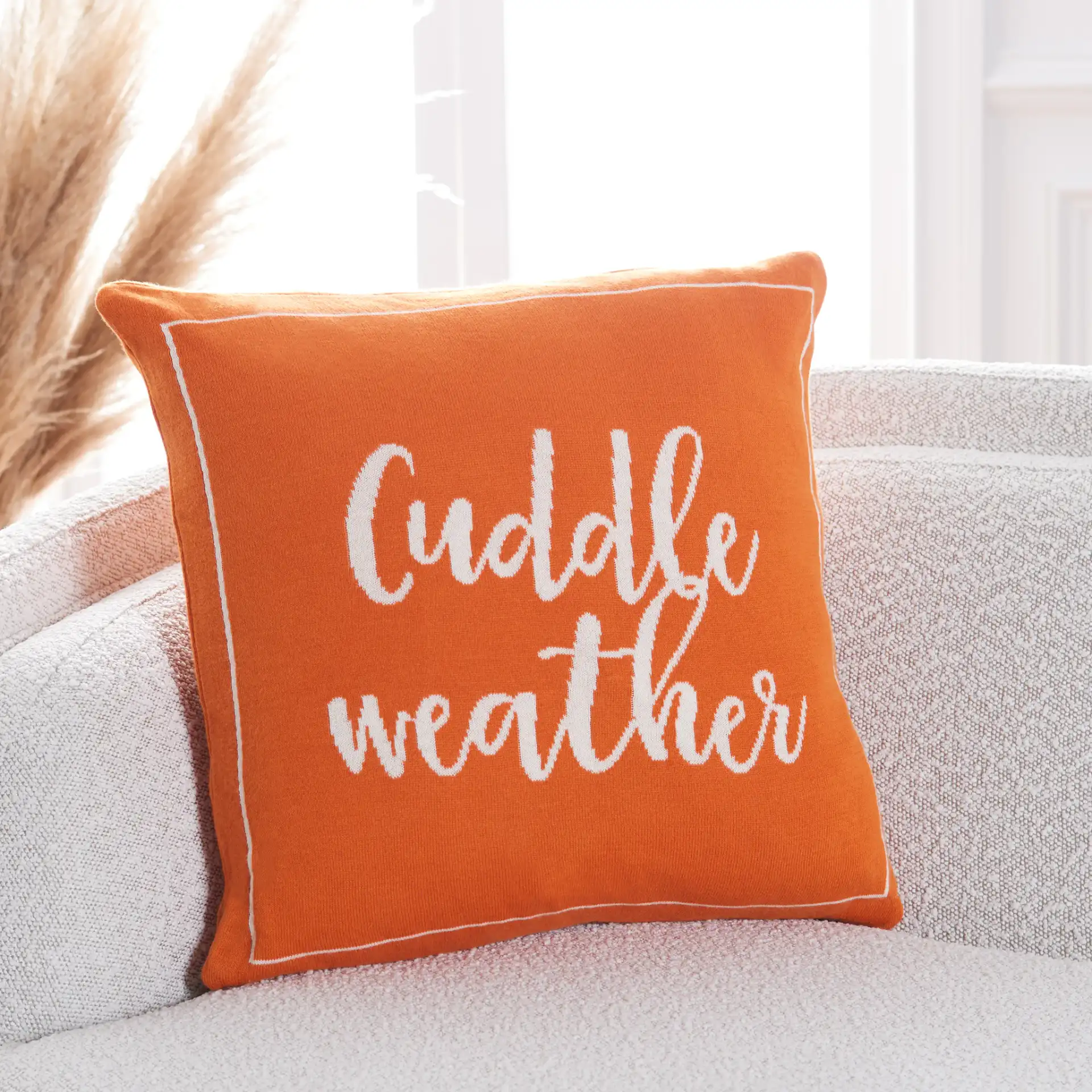 Cuddle Weather Pillow in Orange / Natural in a styled room