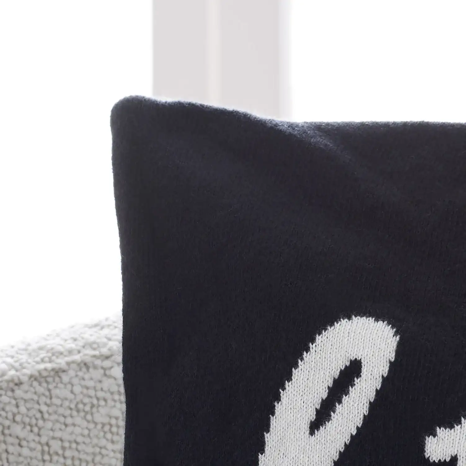 Wicked Pillow in Black / Natural in a styled room