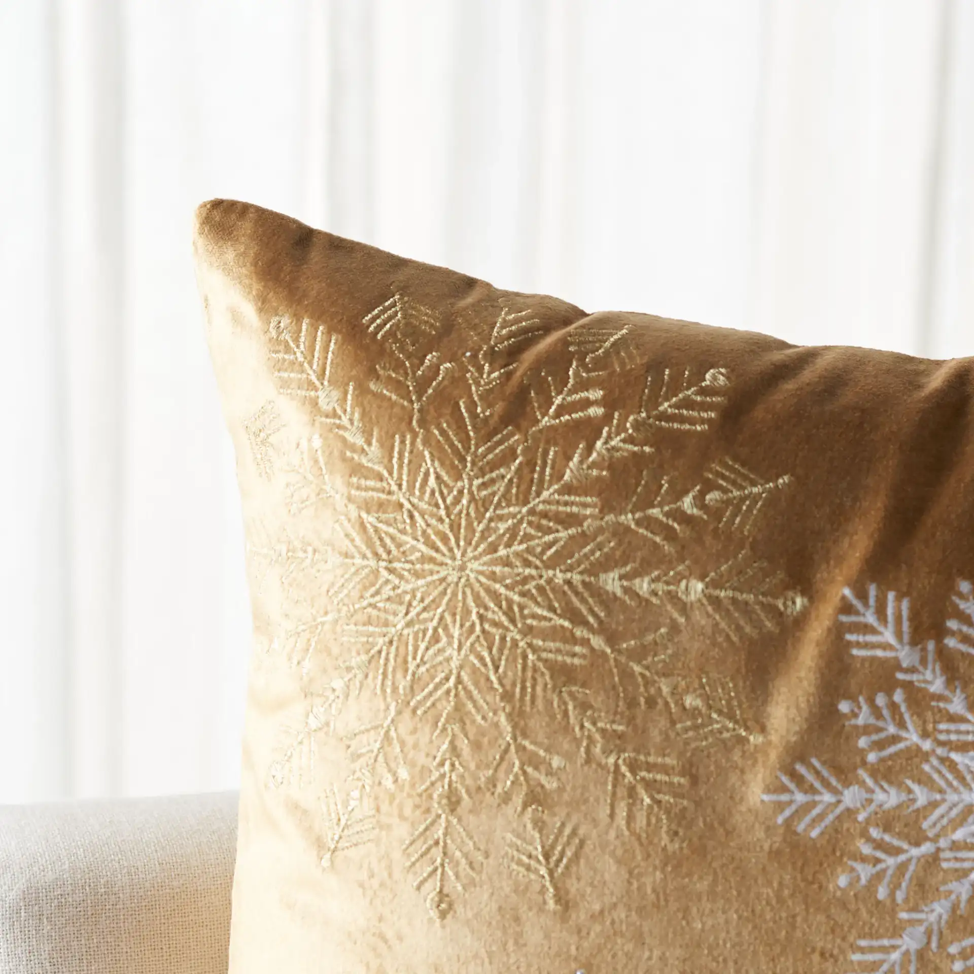 Cinthia Snowflake Pillow in Red in a styled room