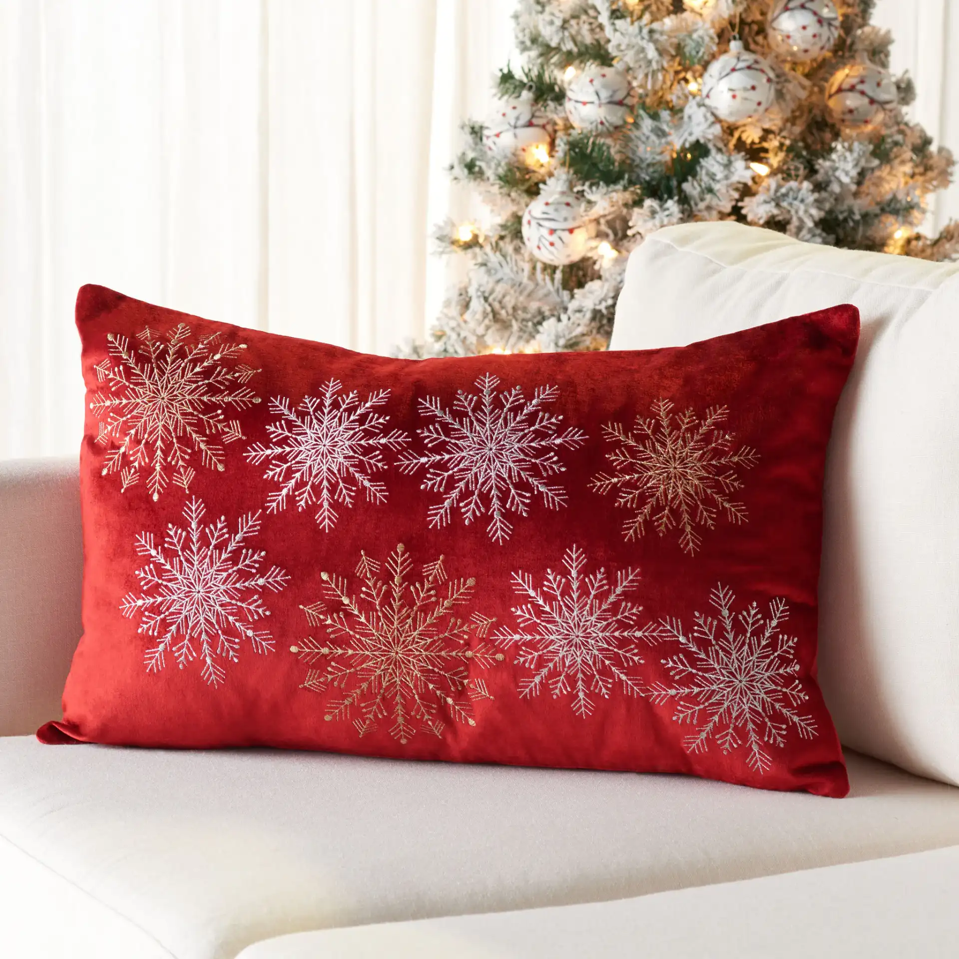 Cinthia Snowflake Pillow in Red in a styled room