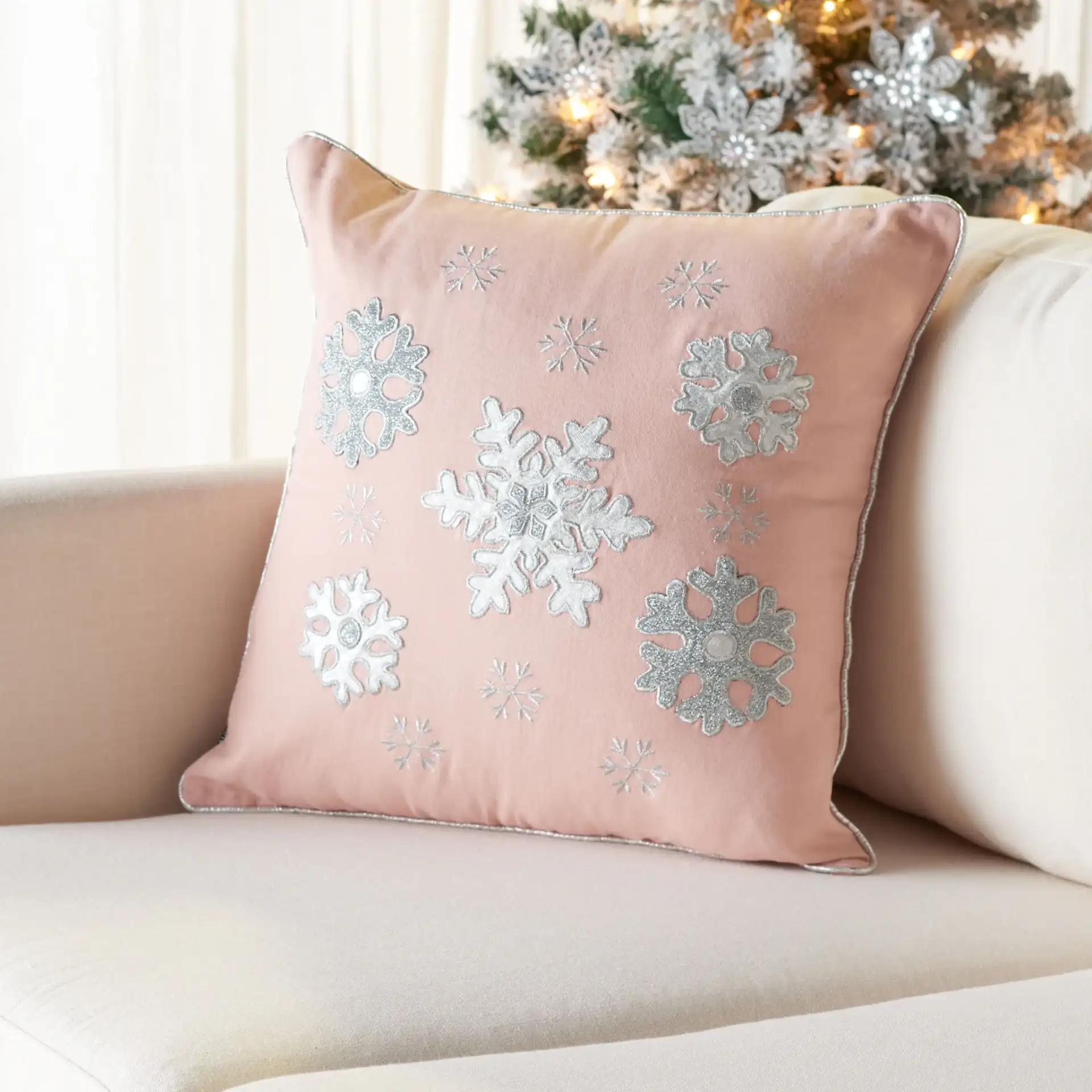 Sunderland Snowflake Pillow in Blush Pink in a styled room