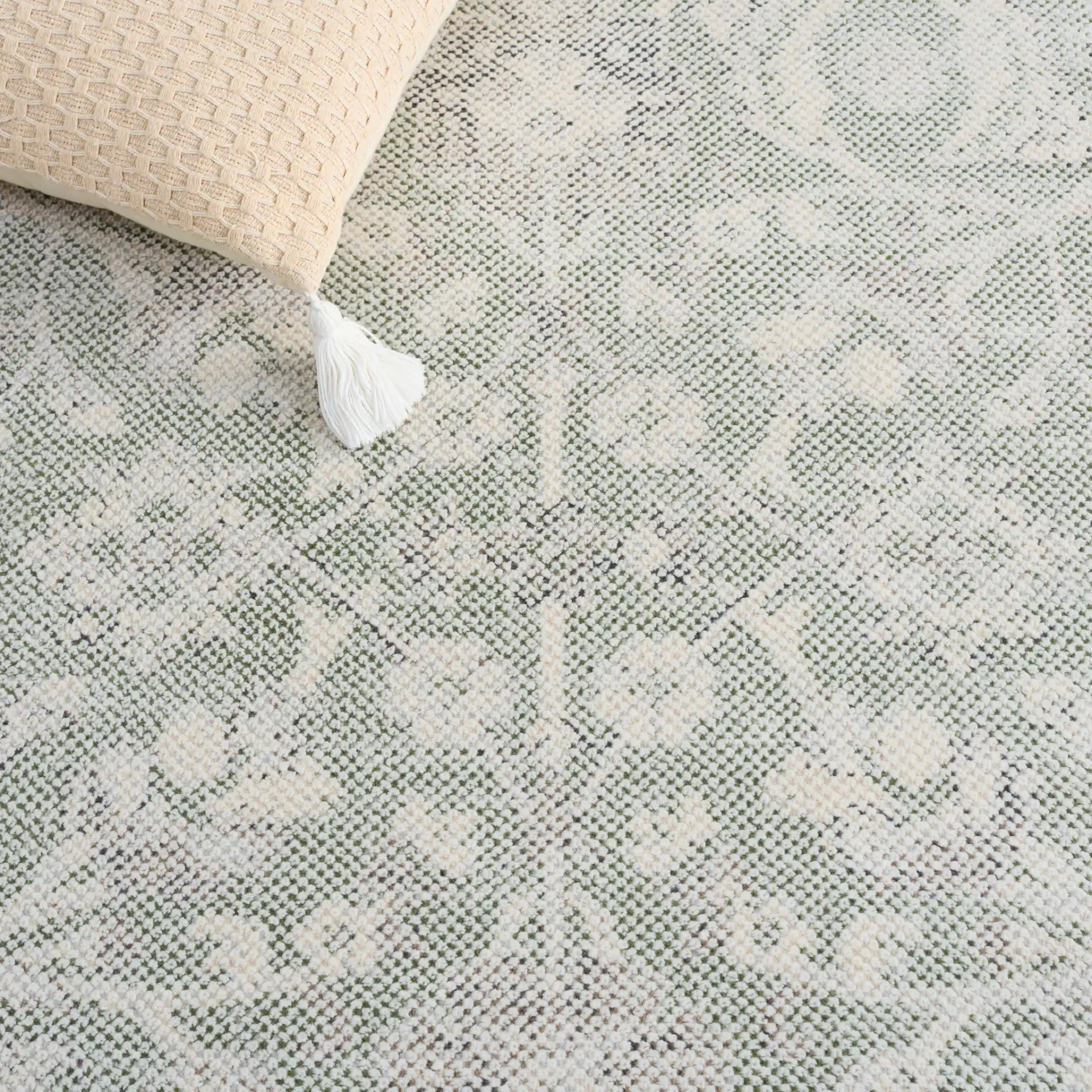 Harrison Bordered Floral Rug in Green / Ivory in a styled room