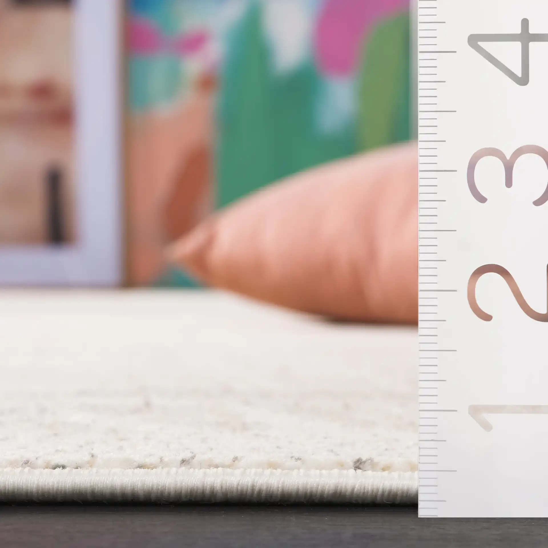 Herat Textured Solid Rug in Ivory / Beige in a styled room