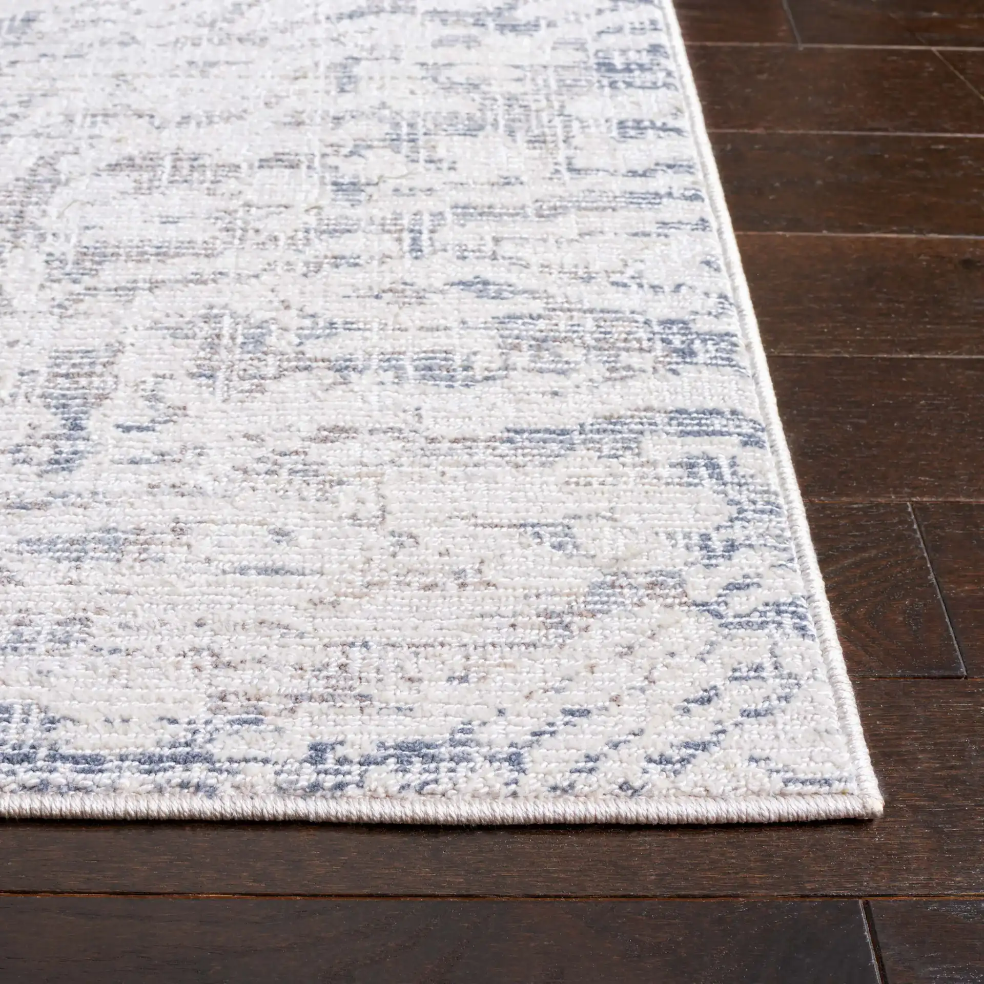 Hunter Weathered Border Rug in Ivory / Dark Gray in a styled room