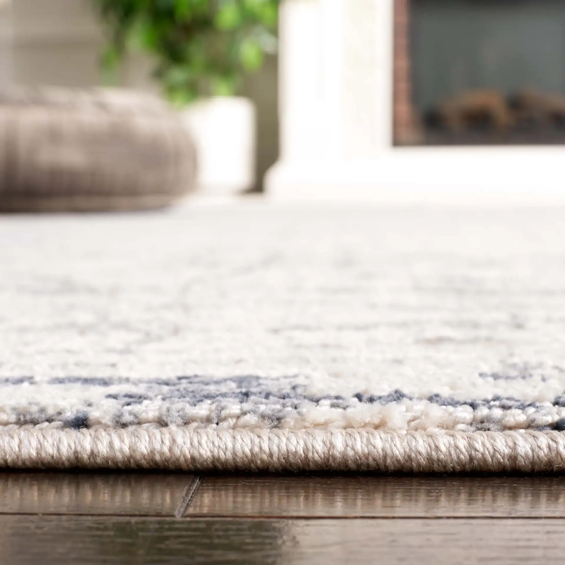 Hunter Weathered Border Rug in Ivory / Dark Gray in a styled room