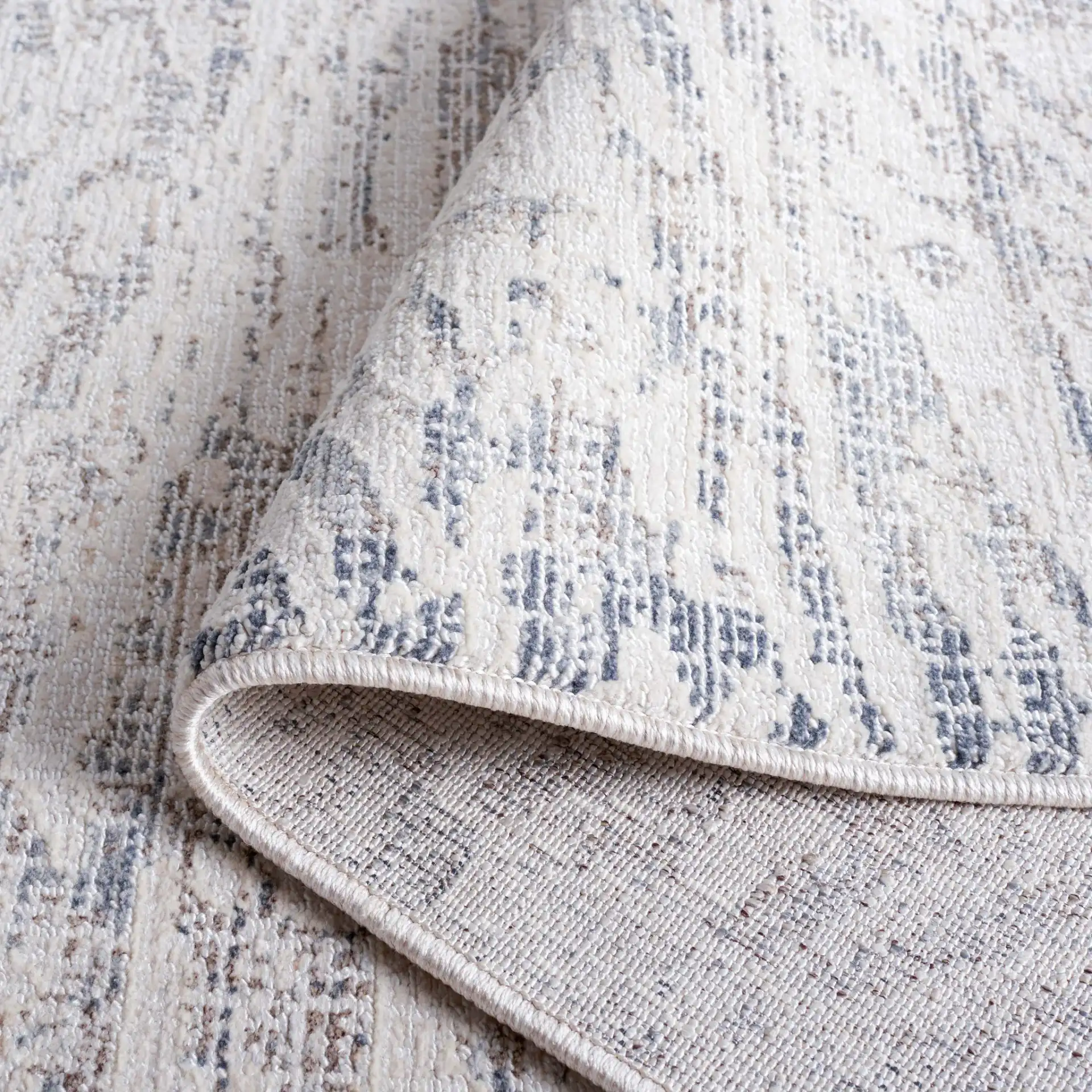 Hunter Weathered Border Rug in Ivory / Dark Gray in a styled room