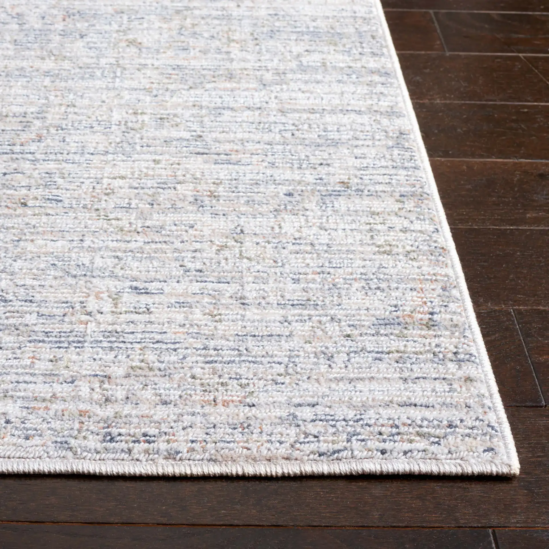 Hunter Striated Abstract Rug in Ivory / Dark Gray / Sage in a styled room
