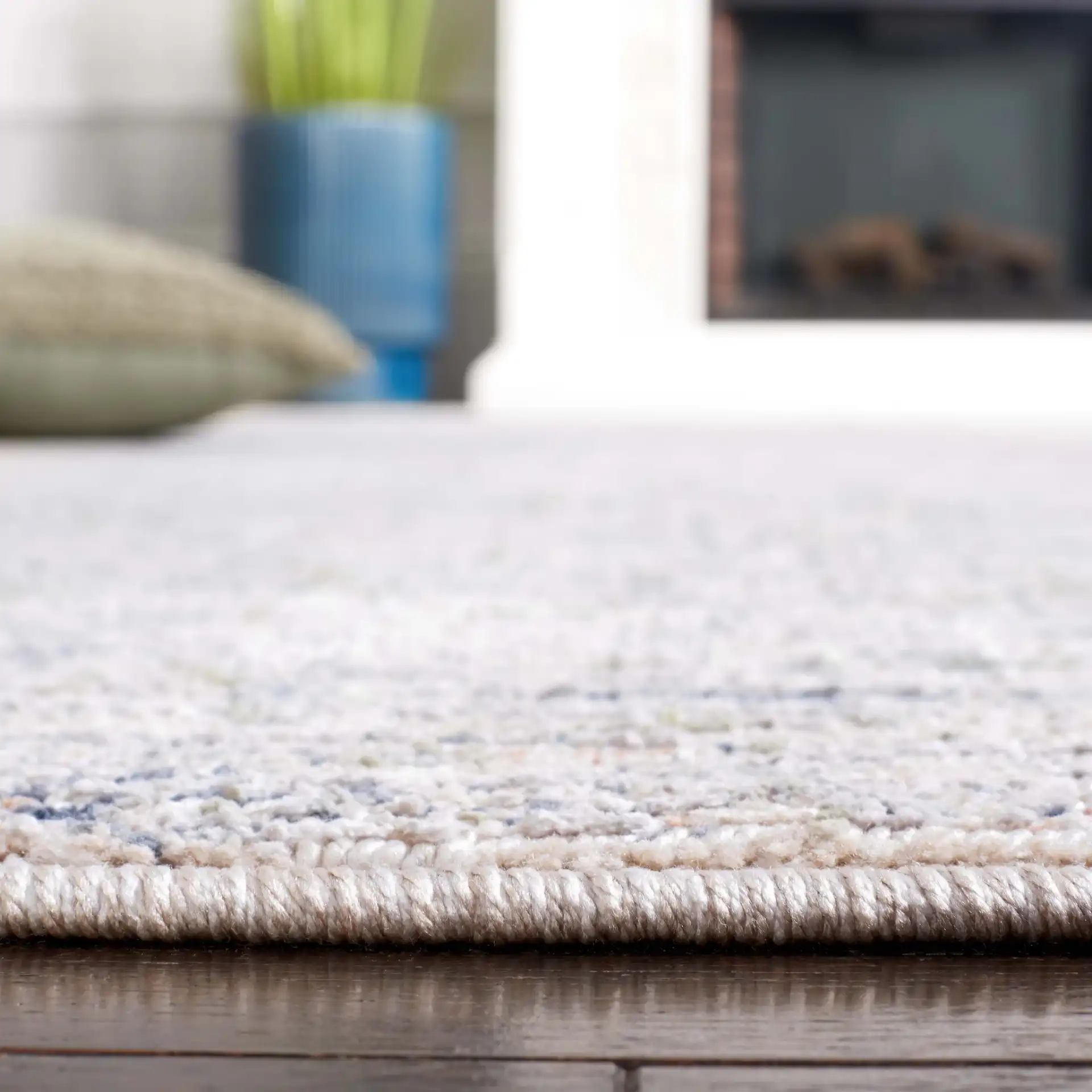 Hunter Striated Abstract Rug in Ivory / Dark Gray / Sage in a styled room