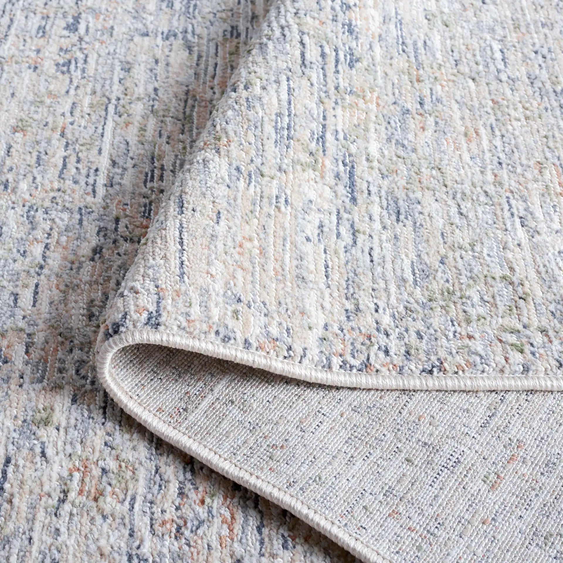 Hunter Striated Abstract Rug in Ivory / Dark Gray / Sage in a styled room