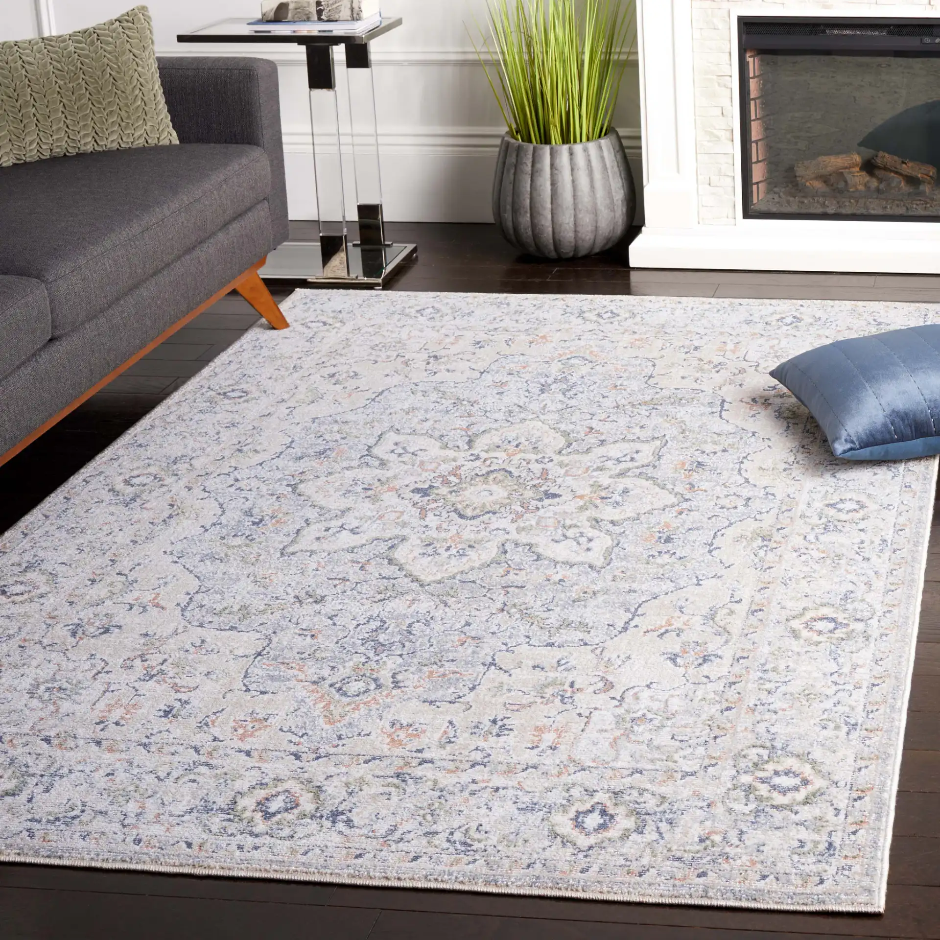 Hunter Distressed Medallion Rug in Ivory Gray / Dark Gray / Beige in a styled room