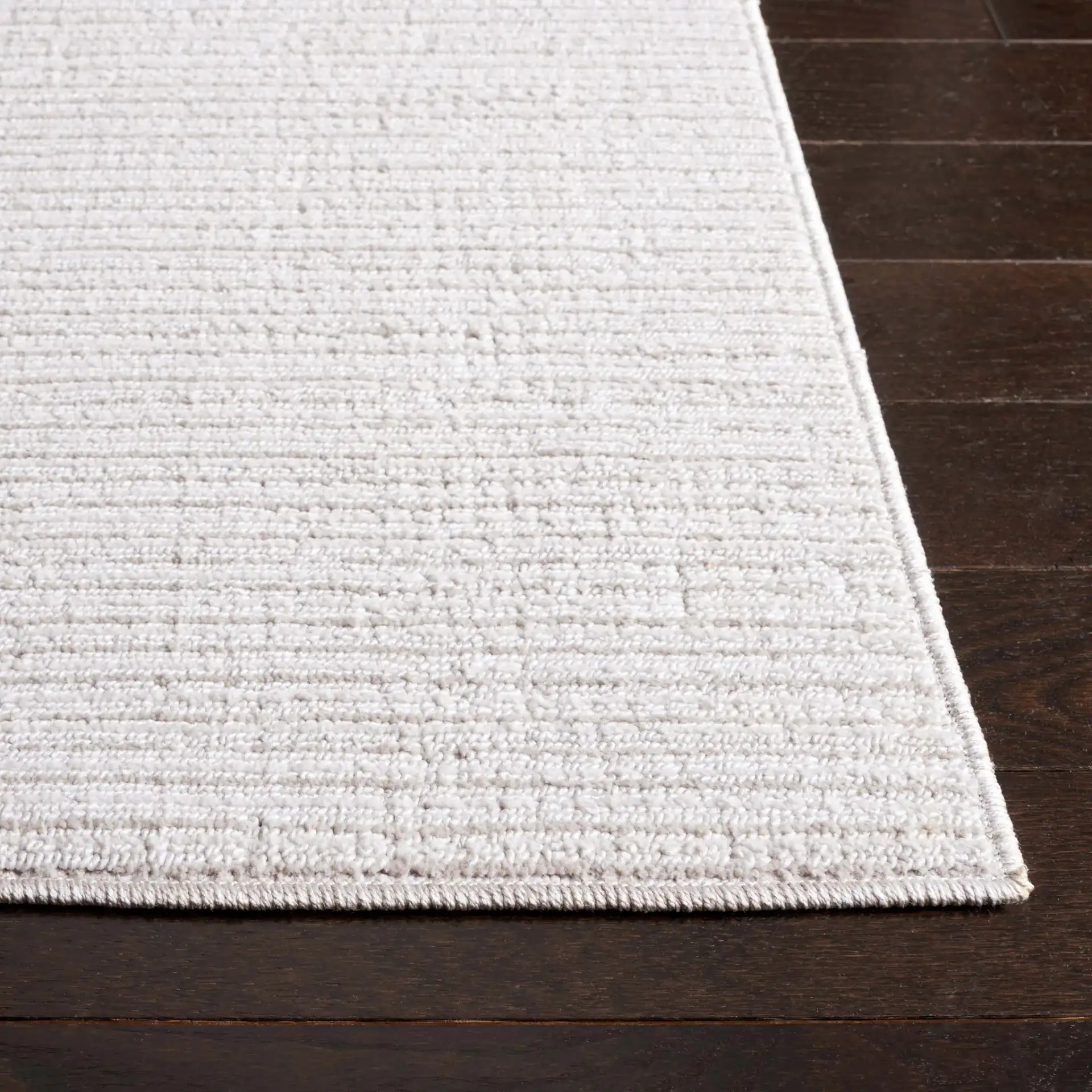 Hunter Ribbed Rug in Ivory / Beige in a styled room