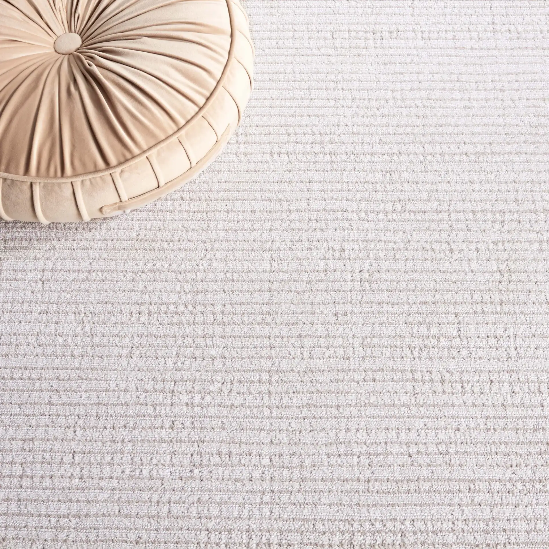 Hunter Ribbed Rug in Ivory / Beige in a styled room
