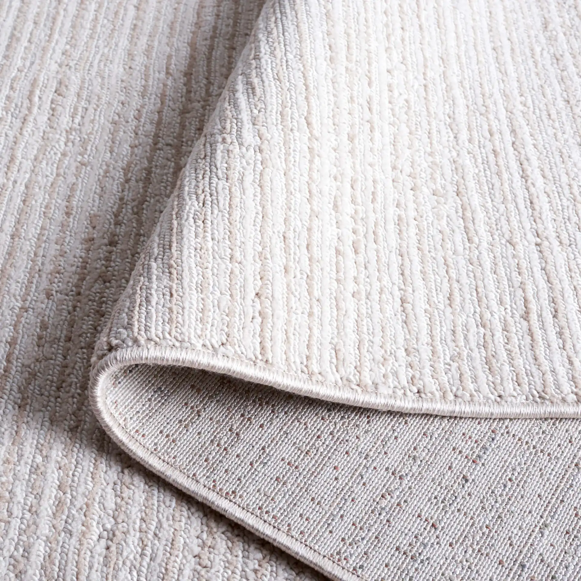 Hunter Ribbed Rug in Ivory / Beige in a styled room