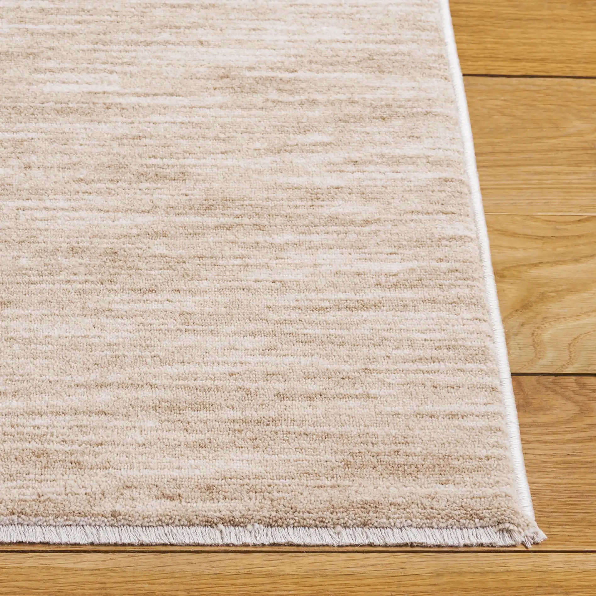 Haven Heathered Solid Rug in Beige in a styled room