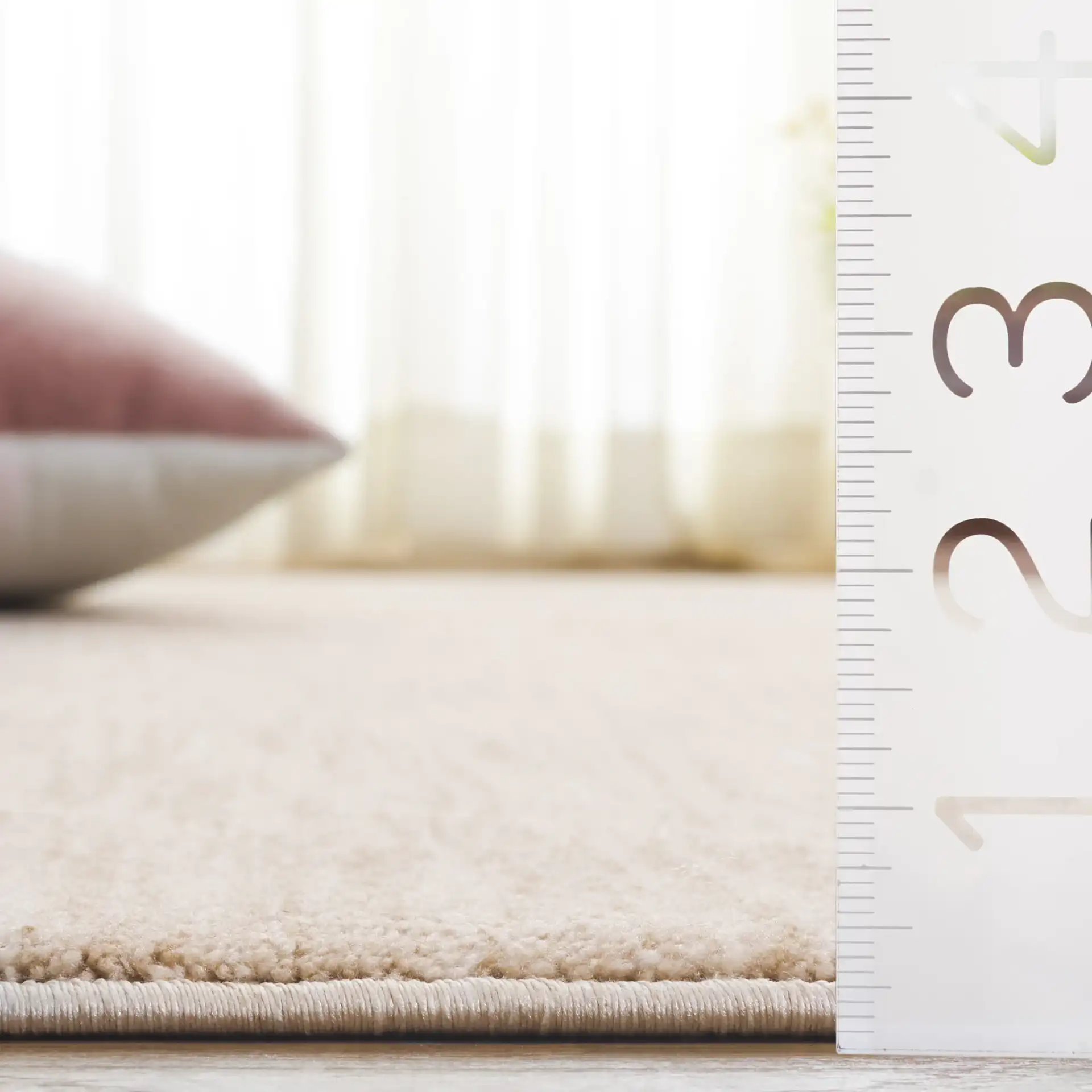 Haven Heathered Solid Rug in Beige in a styled room