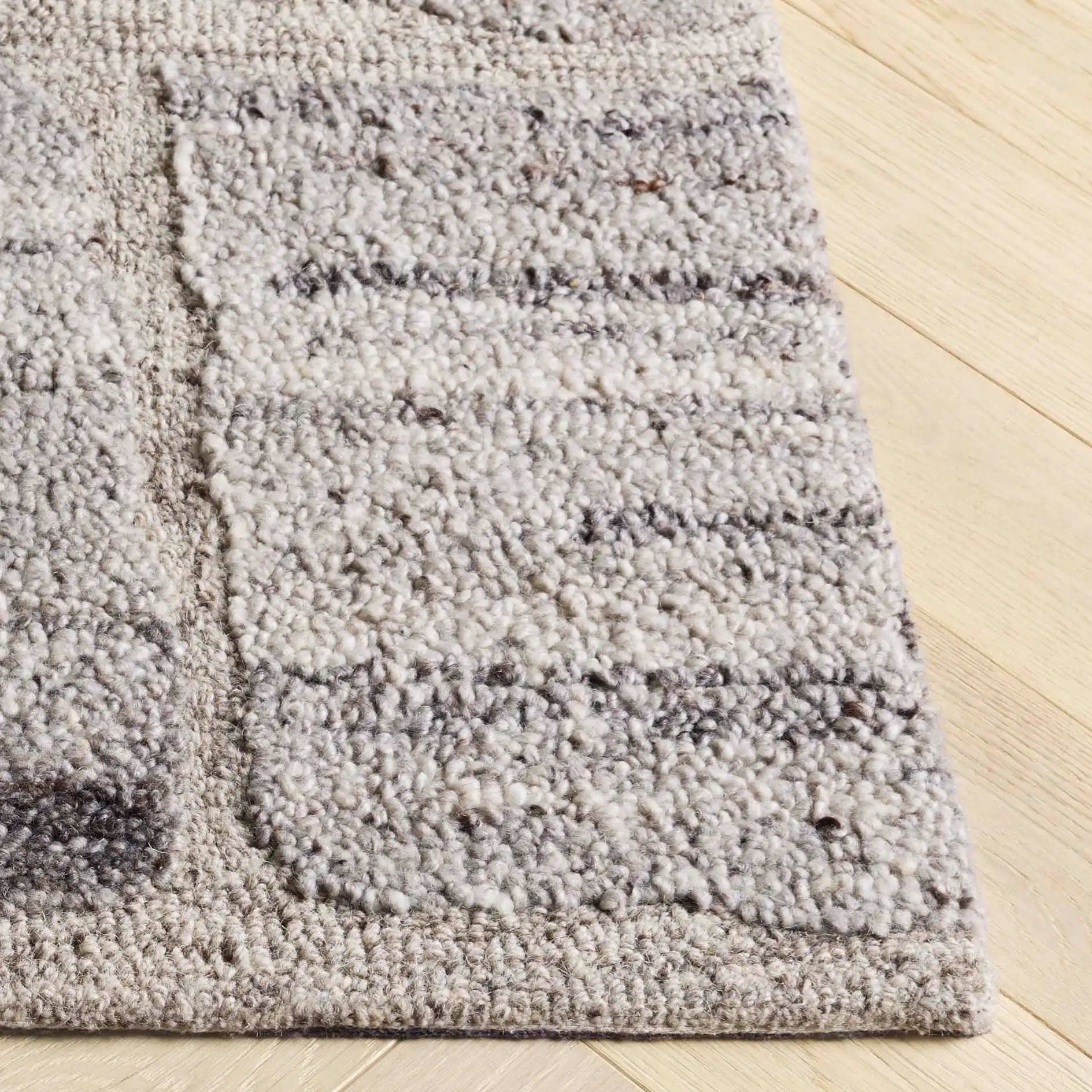 Harvest Cobblestone Hand-Tufted Wool Rug in Taupe / Gray in a styled room