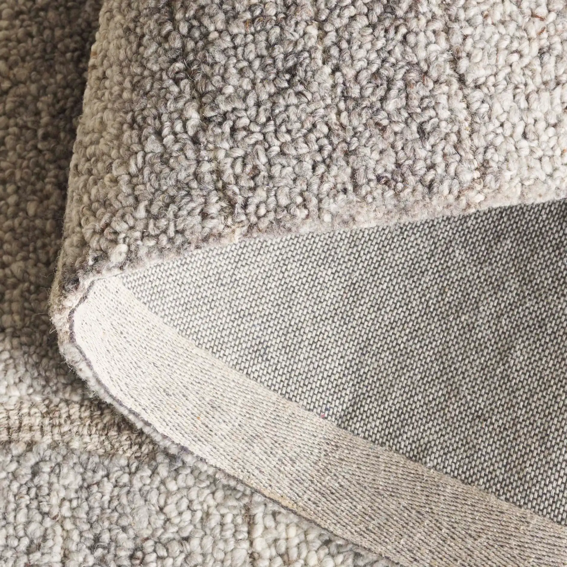 Harvest Cobblestone Hand-Tufted Wool Rug in Taupe / Gray in a styled room