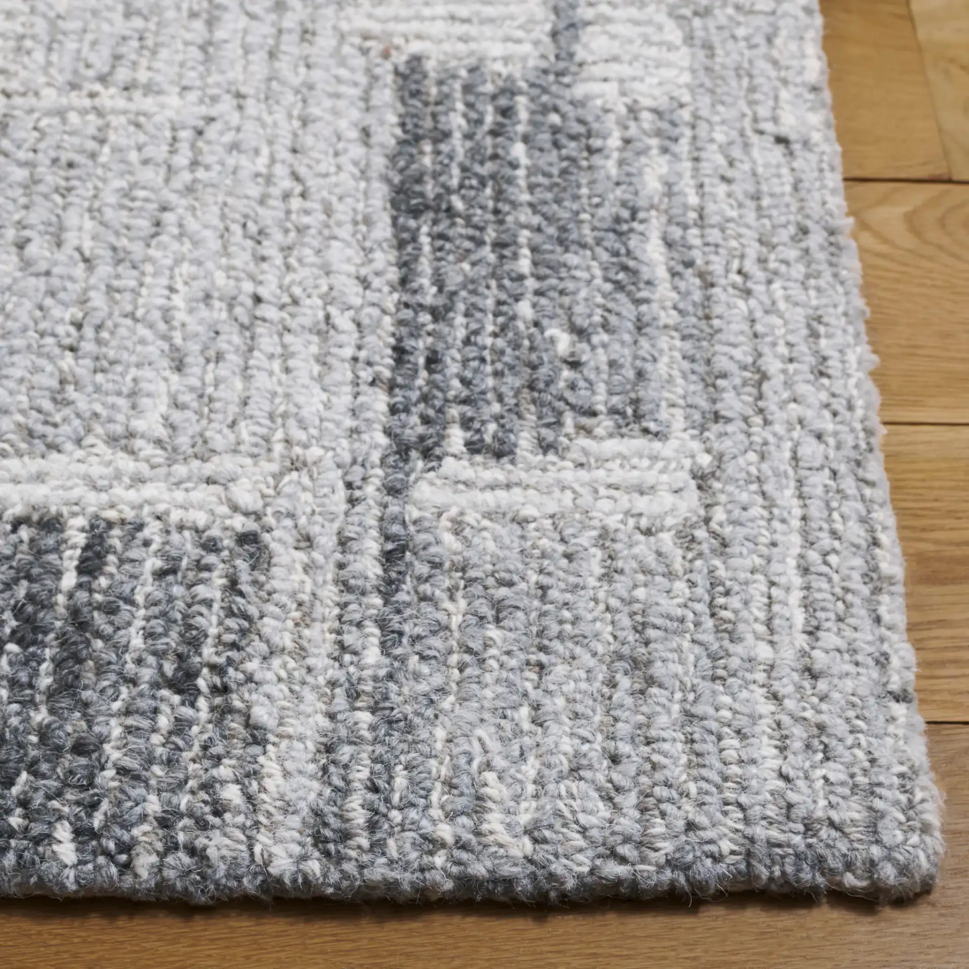 Harvest Abstract Blocks Hand-Tufted Wool Rug in Gray / Ivory in a styled room
