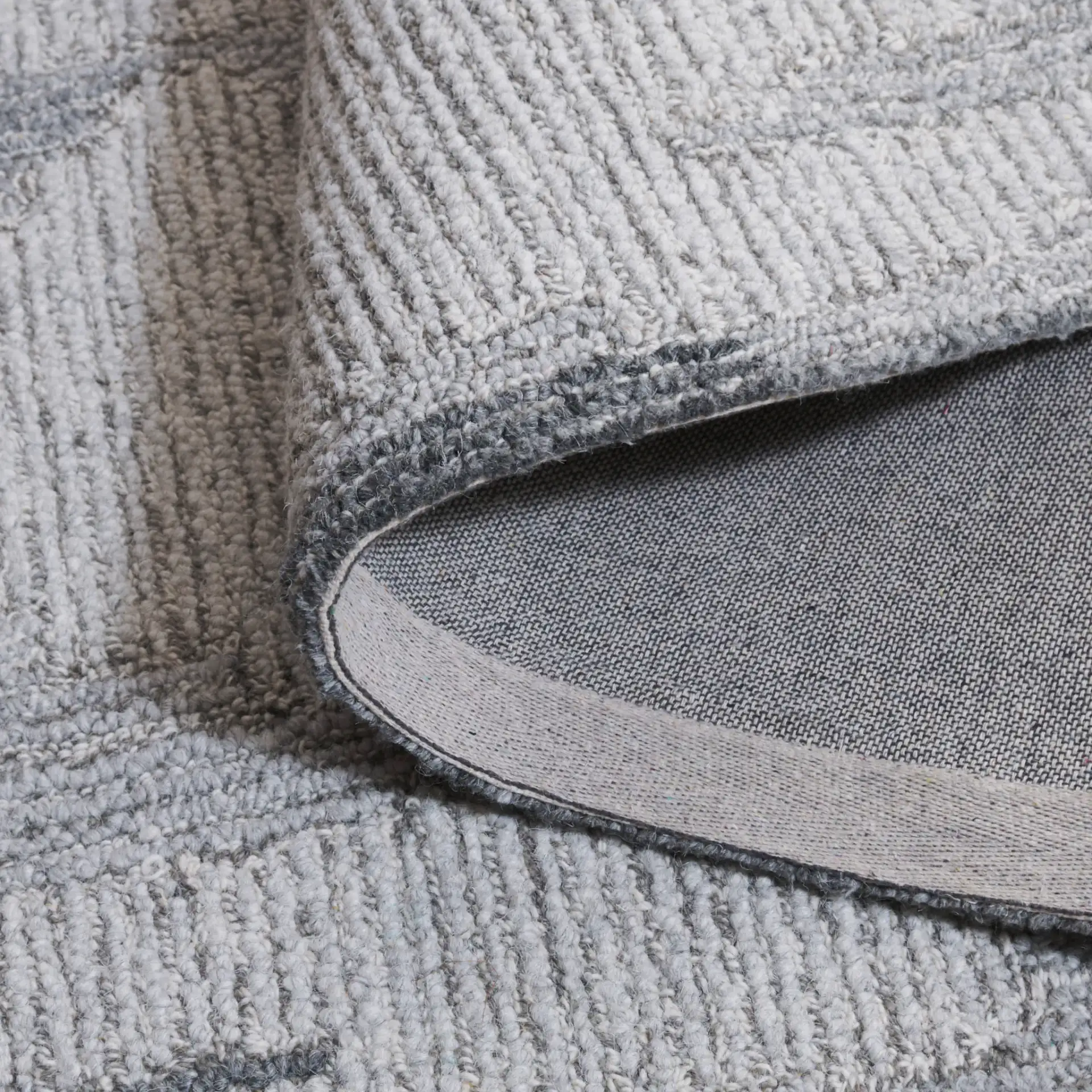 Harvest Abstract Blocks Hand-Tufted Wool Rug in Gray / Ivory in a styled room