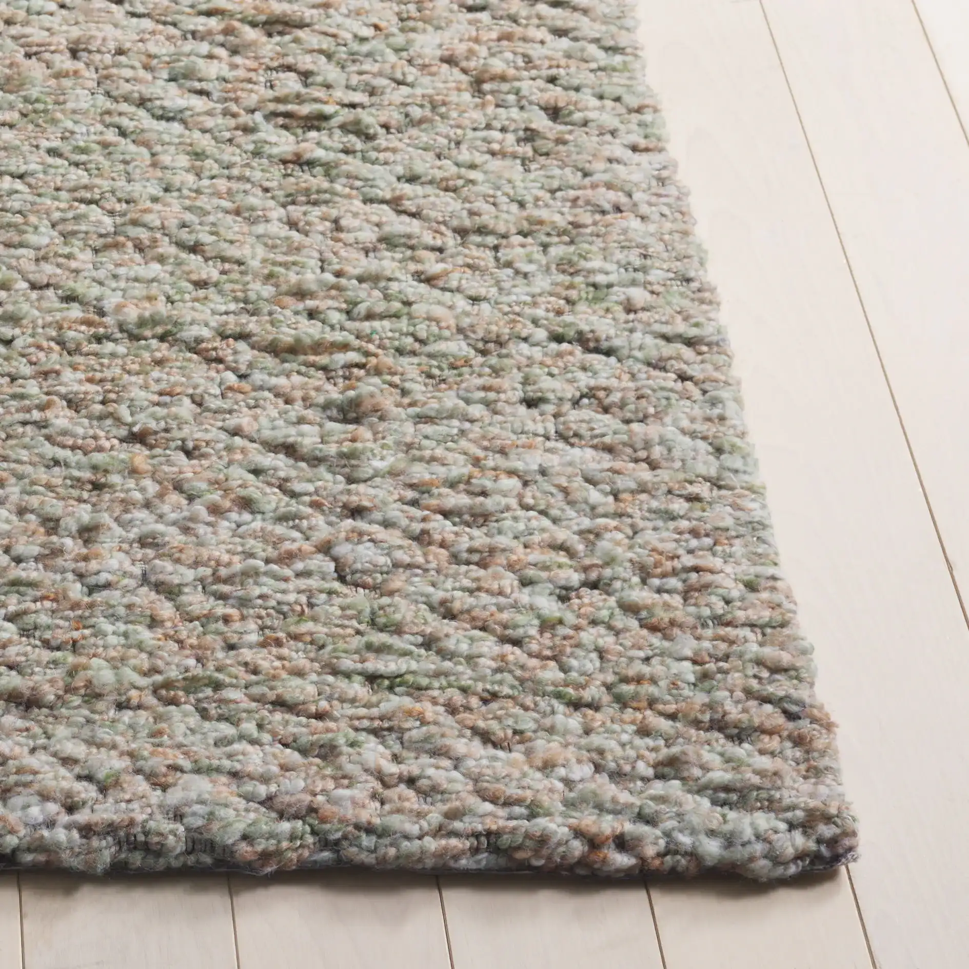 Harvest Diamond Hand-Woven Rug in Green / Beige in a styled room