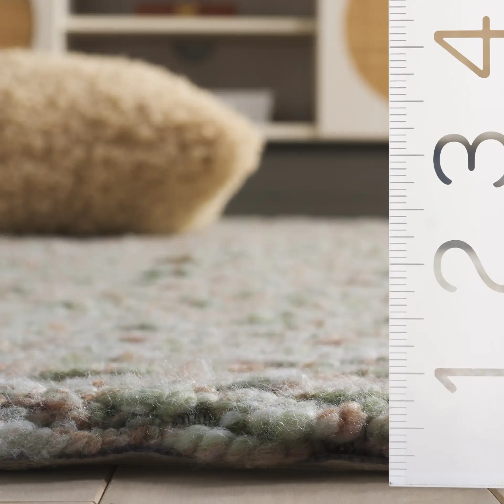 Harvest Diamond Hand-Woven Rug in Green / Beige in a styled room