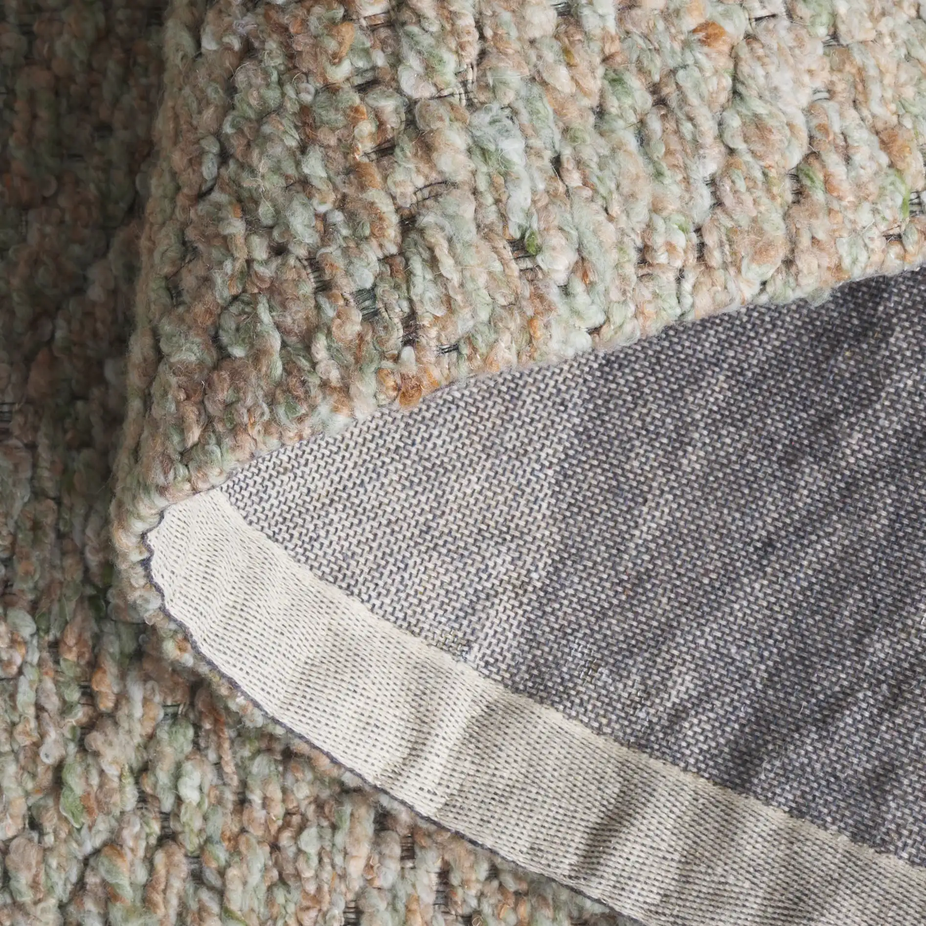 Harvest Diamond Hand-Woven Rug in Green / Beige in a styled room