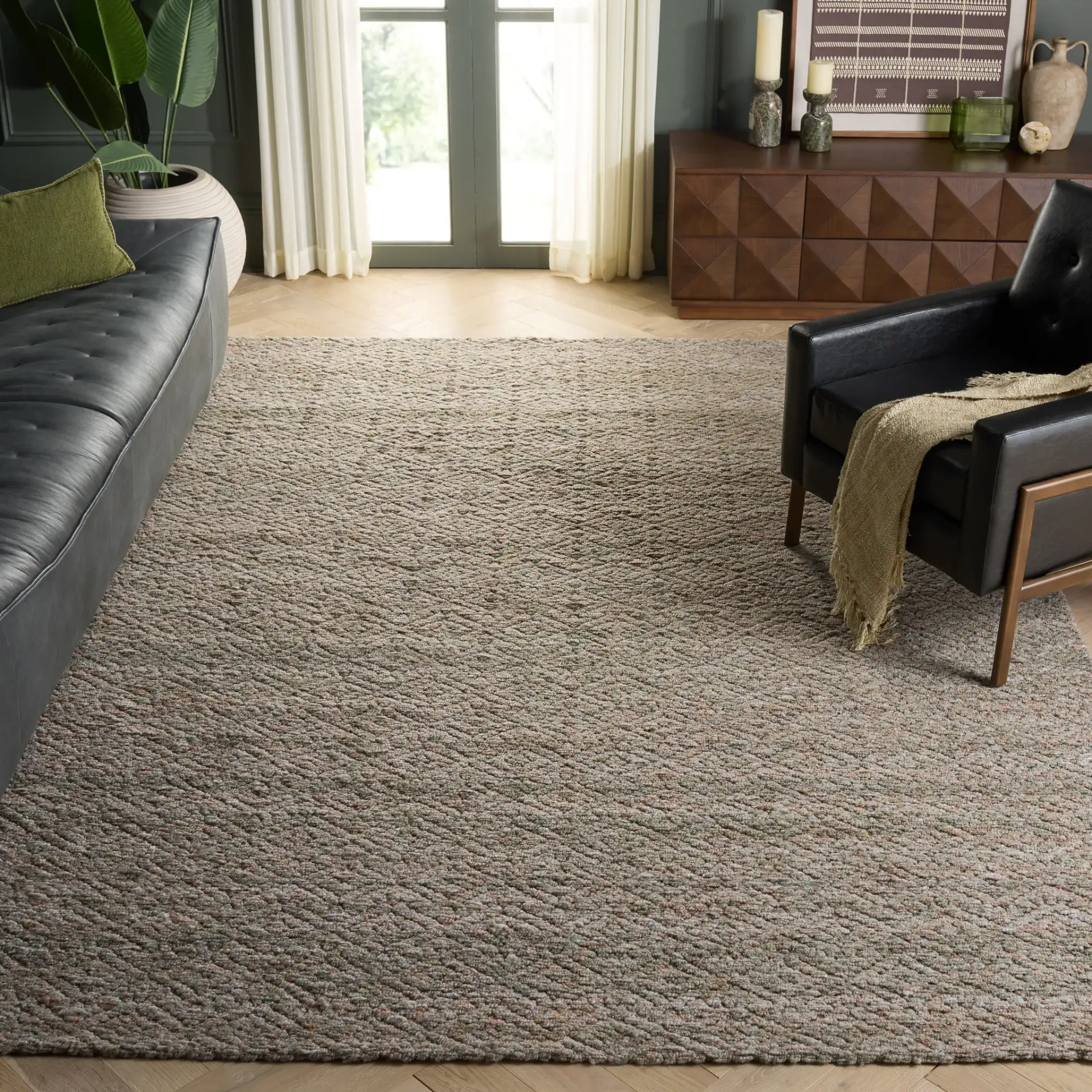 Harvest Diamond Hand-Woven Rug in Green / Beige in a styled room
