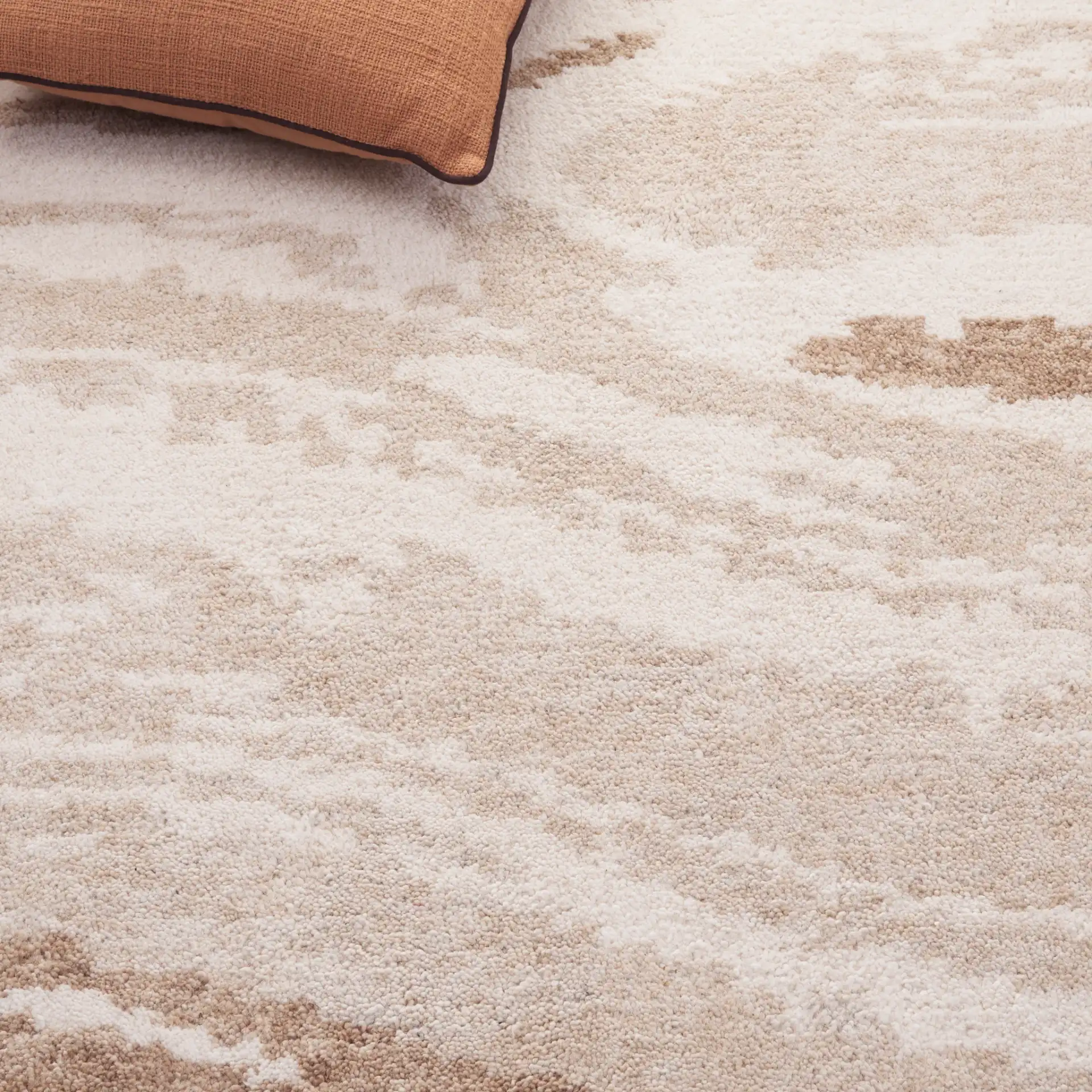 Harvest Abstract Swirl Hand-Tufted Wool Rug in Ivory / Beige in a styled room