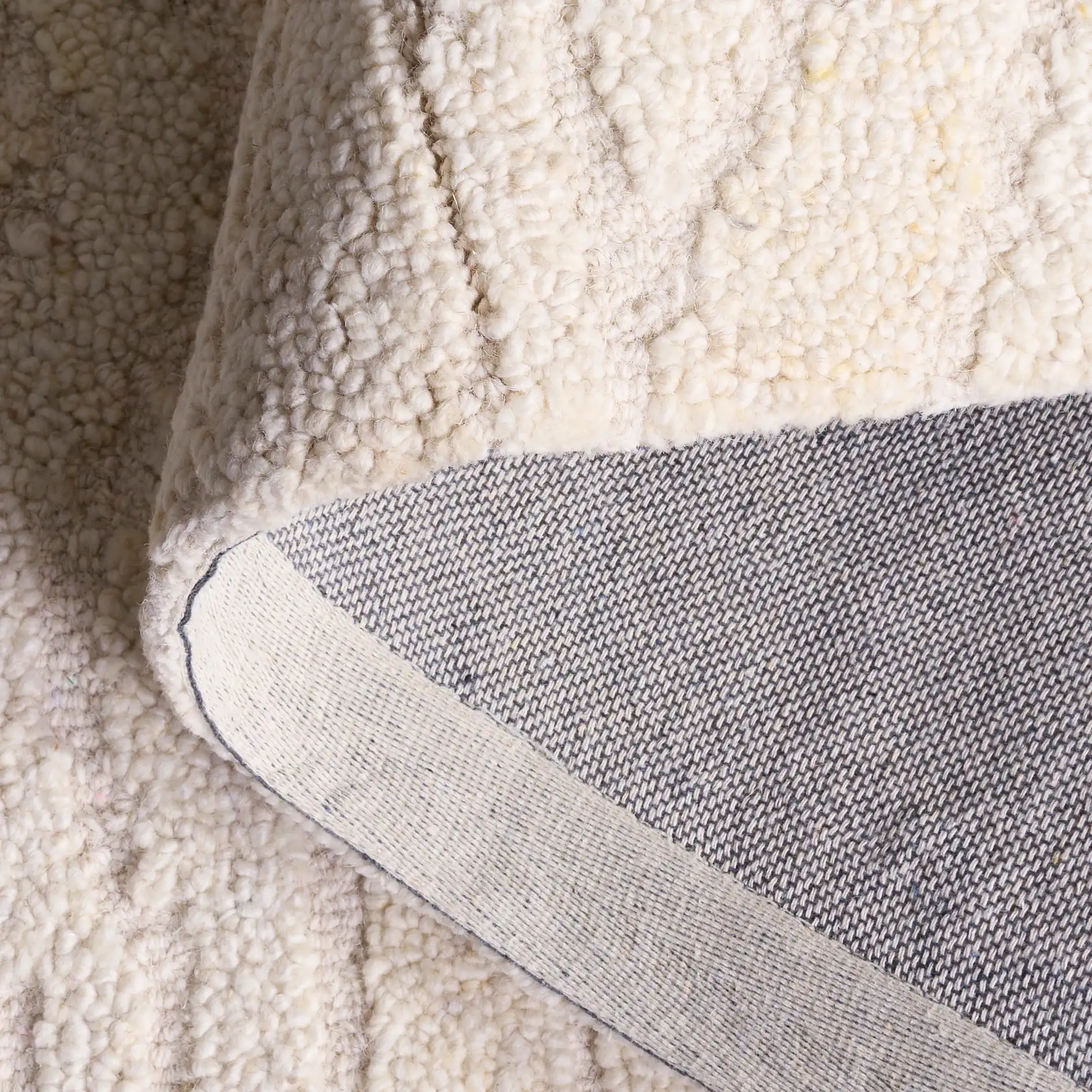 Harvest Wave Hand-Tufted Wool Rug in Ivory in a styled room