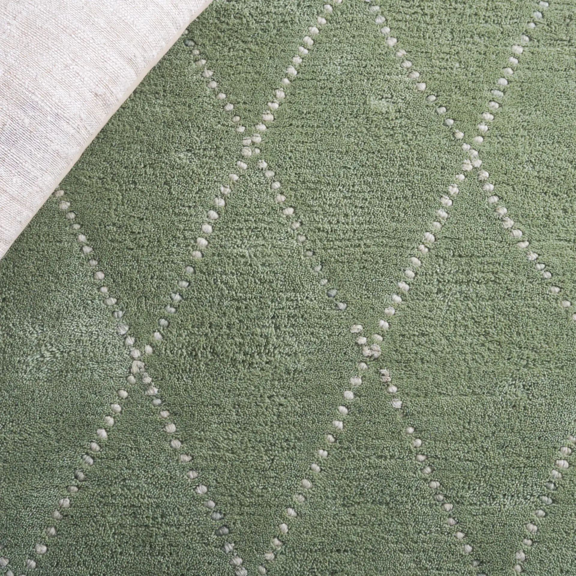 Harvest Diamond Lattice Hand-Tufted Wool Rug in Sage / Ivory in a styled room