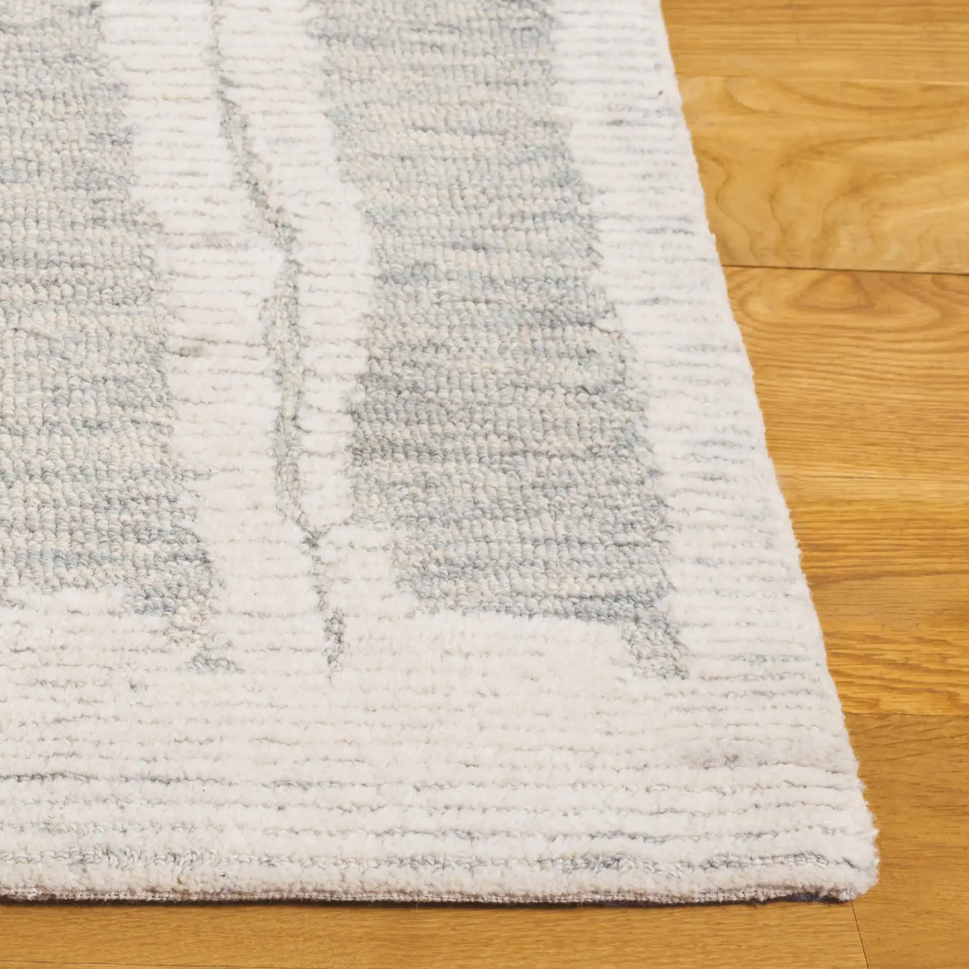 Harvest Abstract Linear Hand-Tufted Wool Rug in Ivory / Light Blue in a styled room